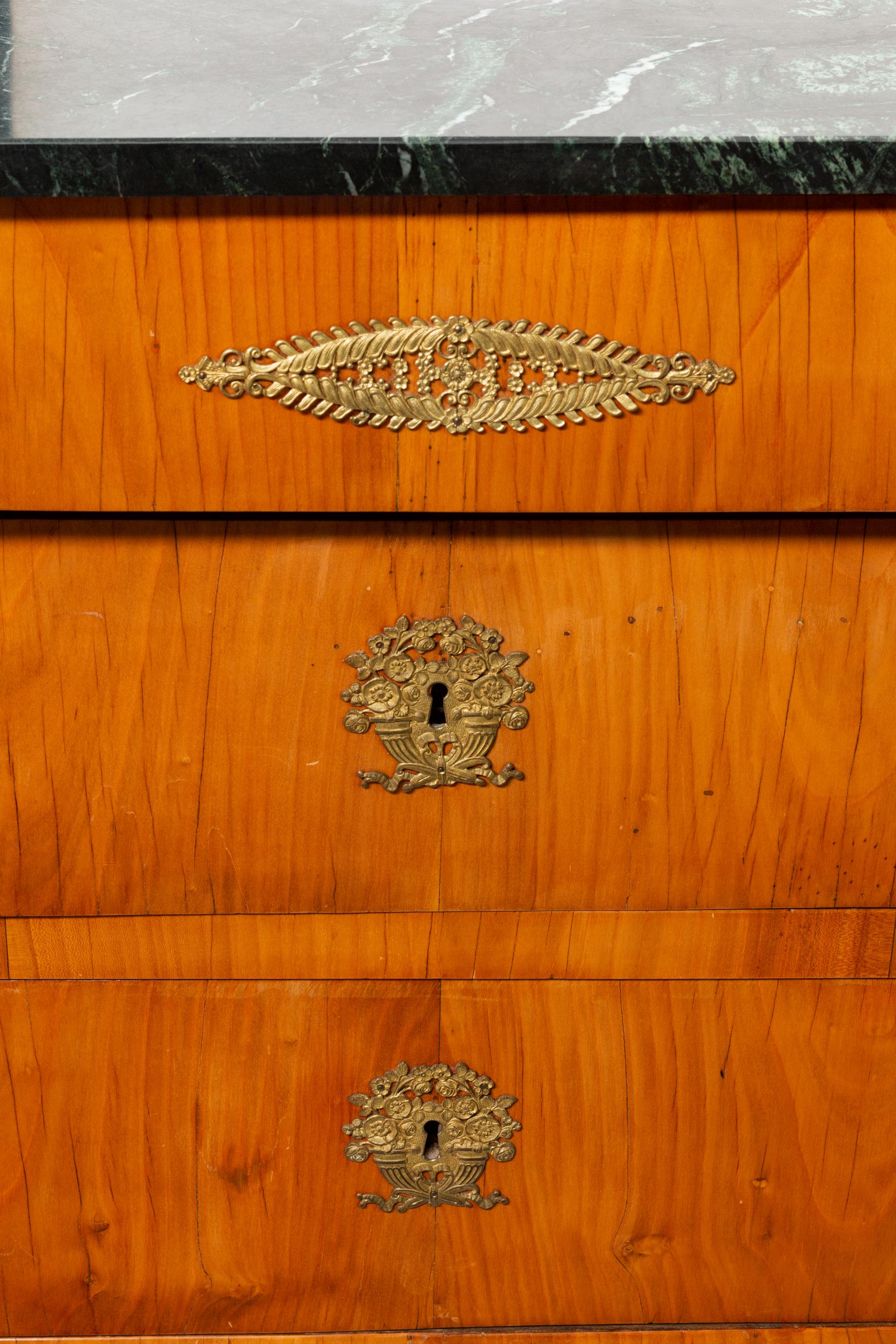 A Pair of Baltic Neoclassical Gilt Bronze Mounted Fruitwood Marble-Top Commodes