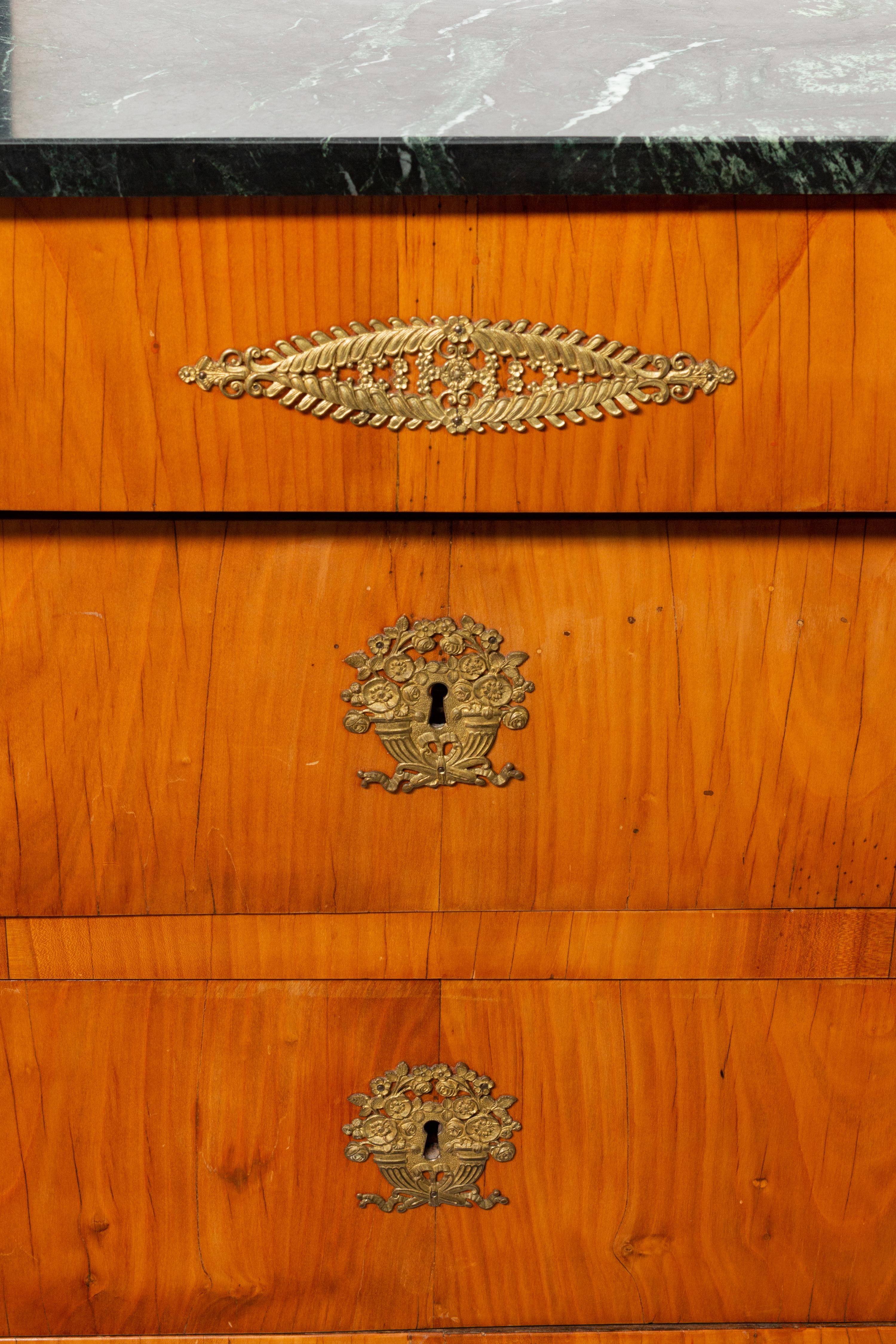 A Pair of Baltic Neoclassical Gilt Bronze Mounted Fruitwood Marble-Top Commodes