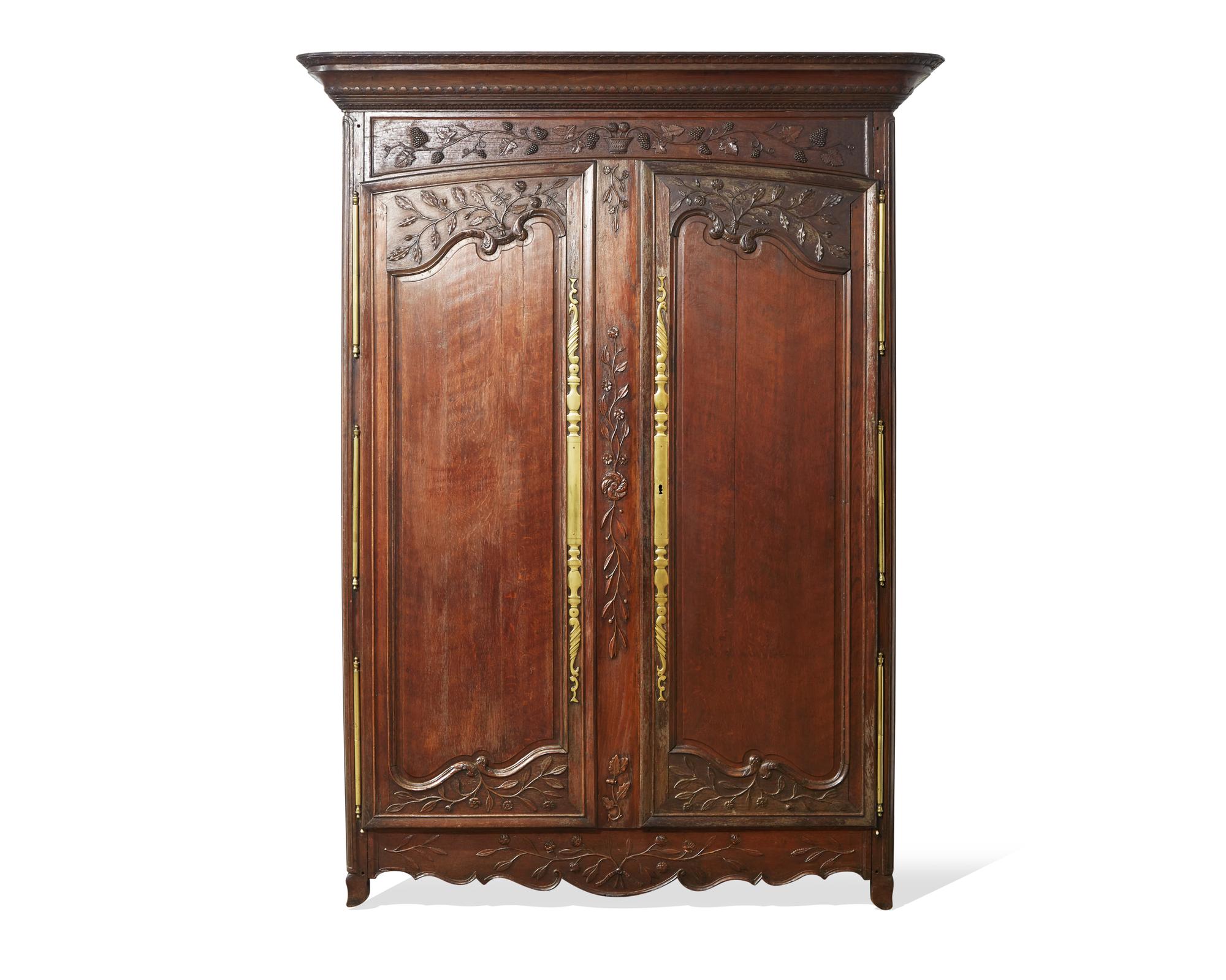 A Louis XVI carved oak armoire, late 18th century