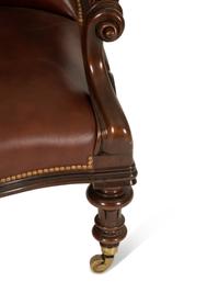 A Regency Style Leather Upholstered Mahogany Open Armchair — 20th Century
