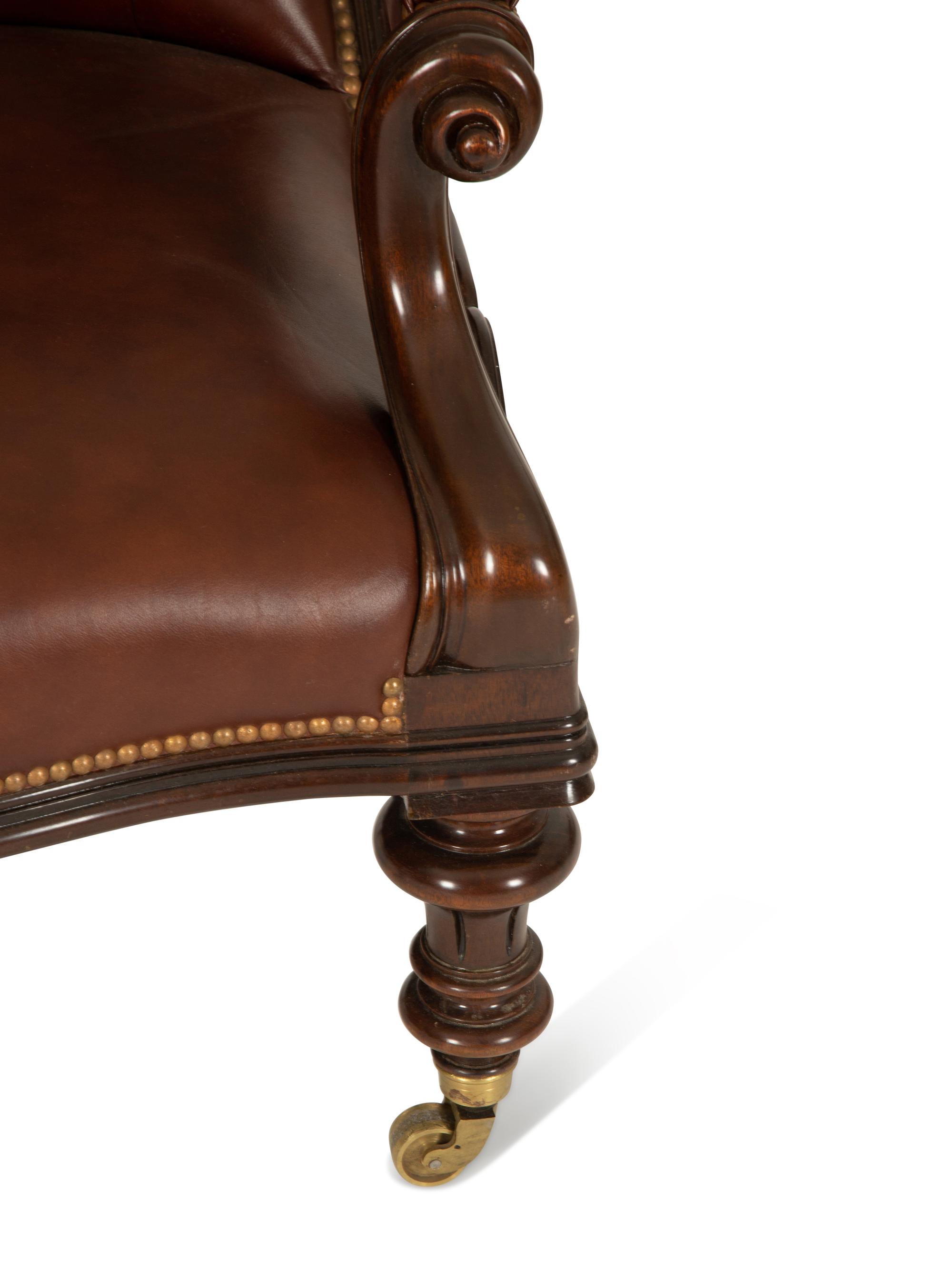 A Regency Style Leather Upholstered Mahogany Open Armchair — 20th Century