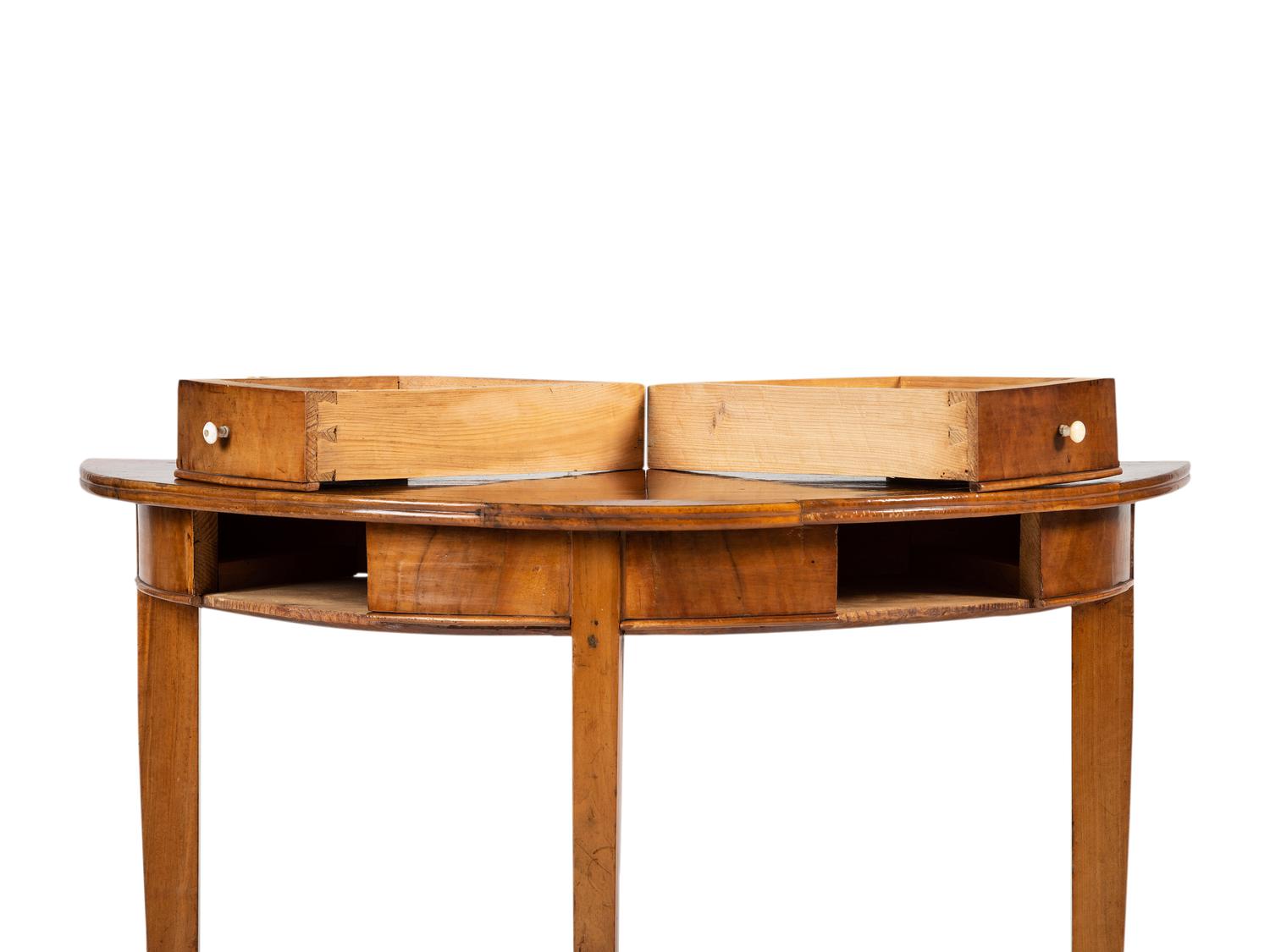 A Biedermeier Figured Birch Demilune Table