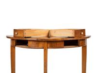 A Biedermeier Figured Birch Demilune Table