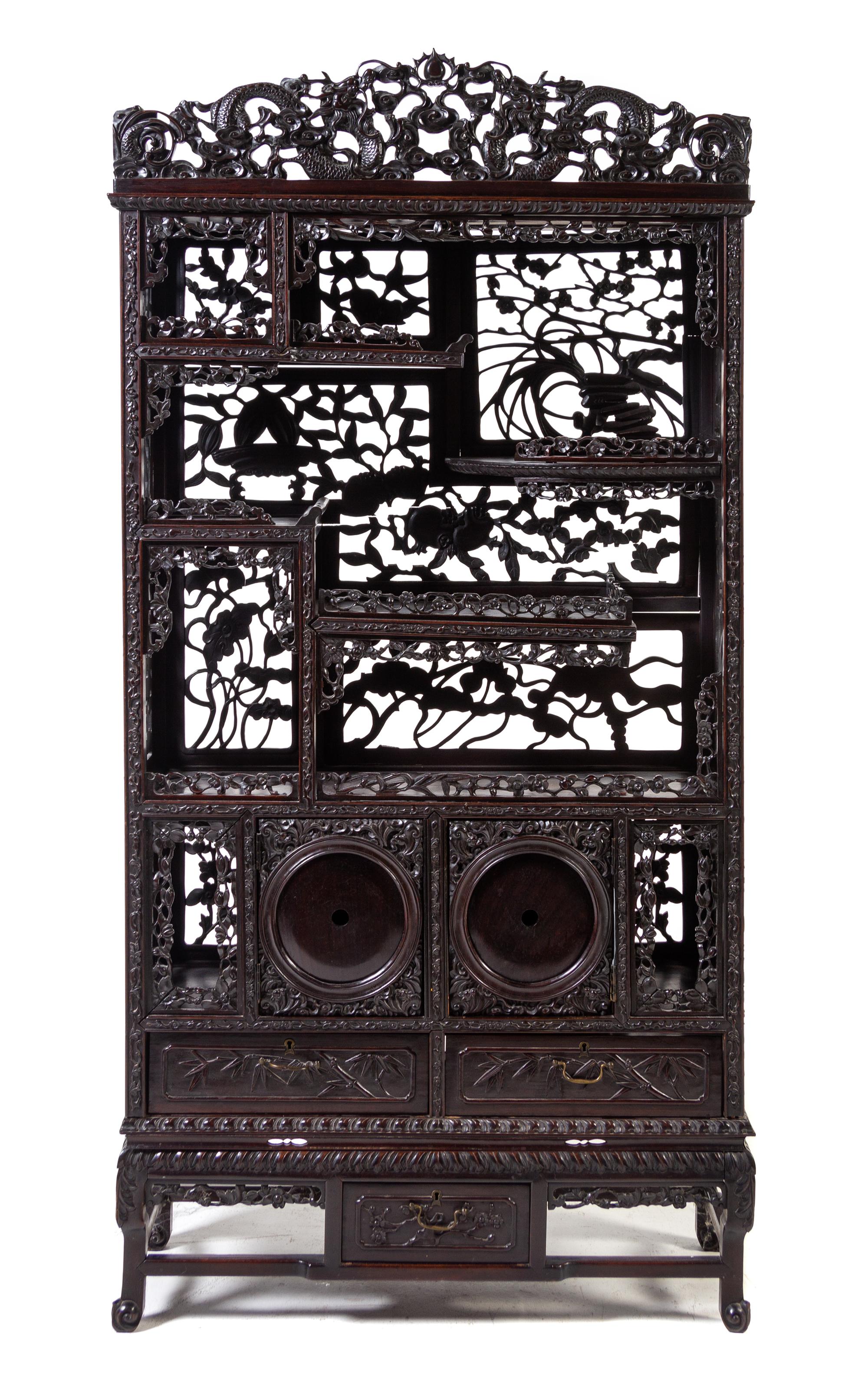 A Japanese Carved Hardwood Etagere Height 65 1/2 x width 32 x depth 11 1/2 inches. — LATE 19TH CENTURY