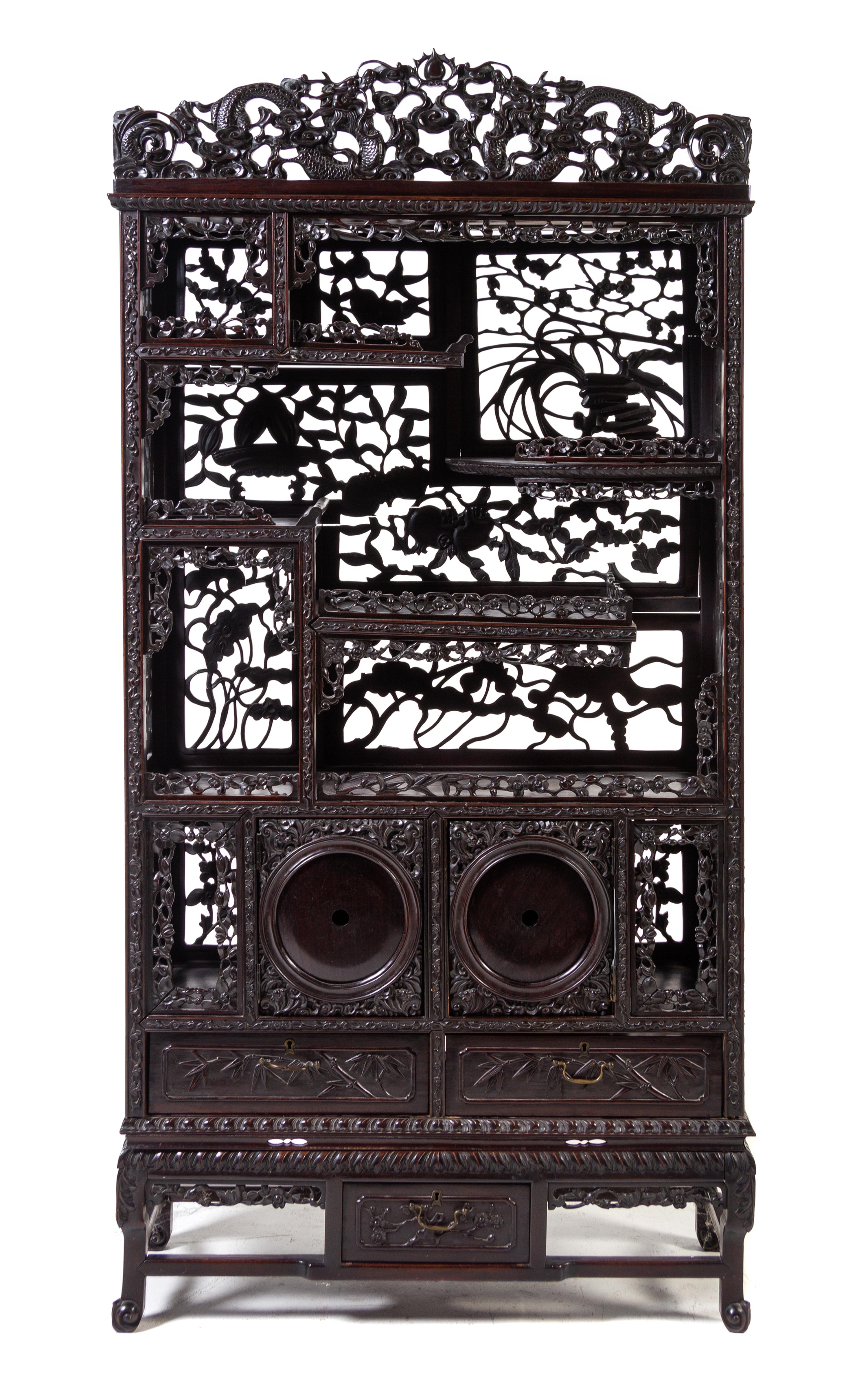 A Japanese Carved Hardwood Etagere Height 65 1/2 x width 32 x depth 11 1/2 inches. — LATE 19TH CENTURY