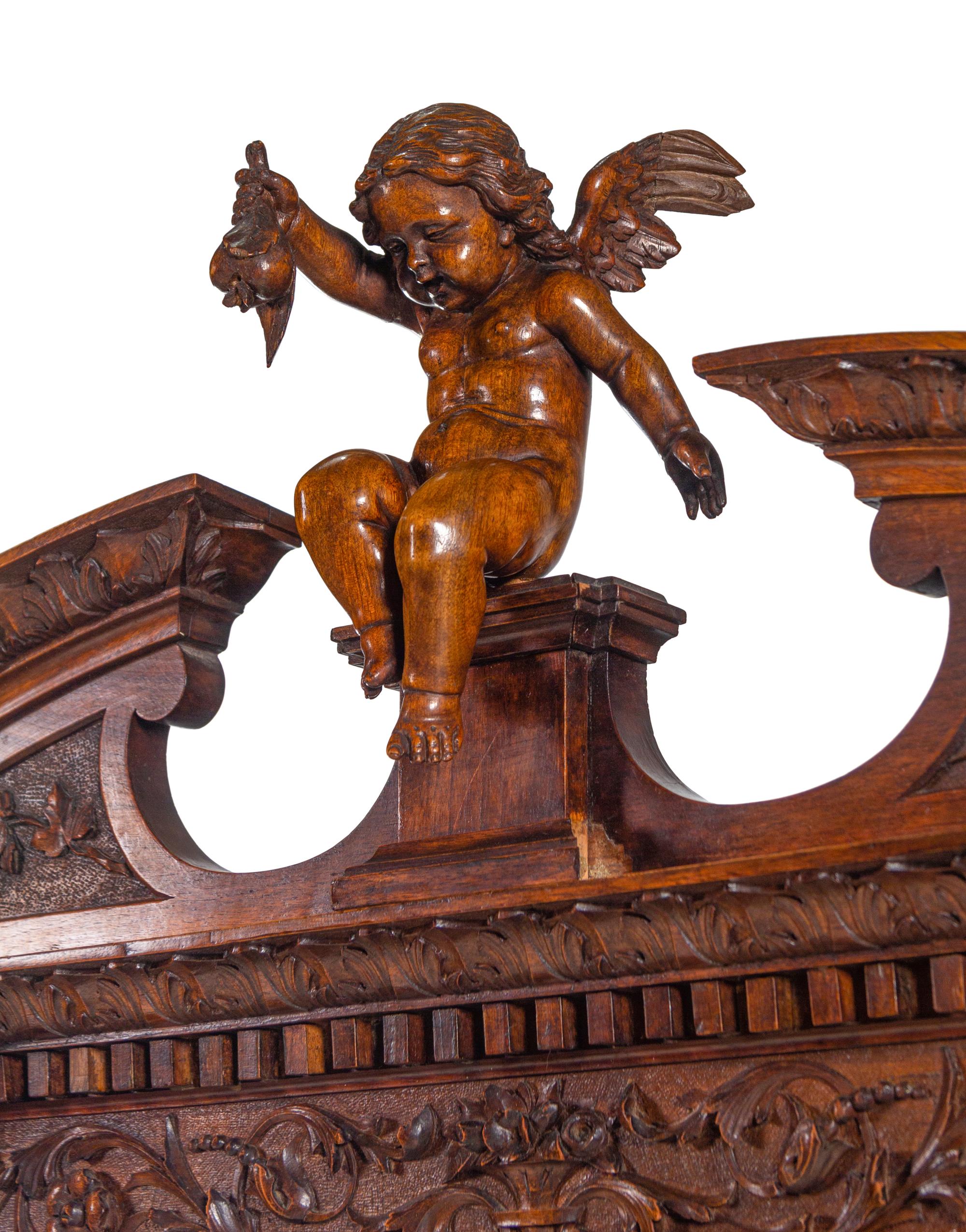 A Renaissance Revival Carved Walnut Cabinet on Stand