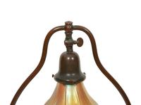 A Handel Bronze Desk Lamp and Two Steuben Aurene Glass Shades