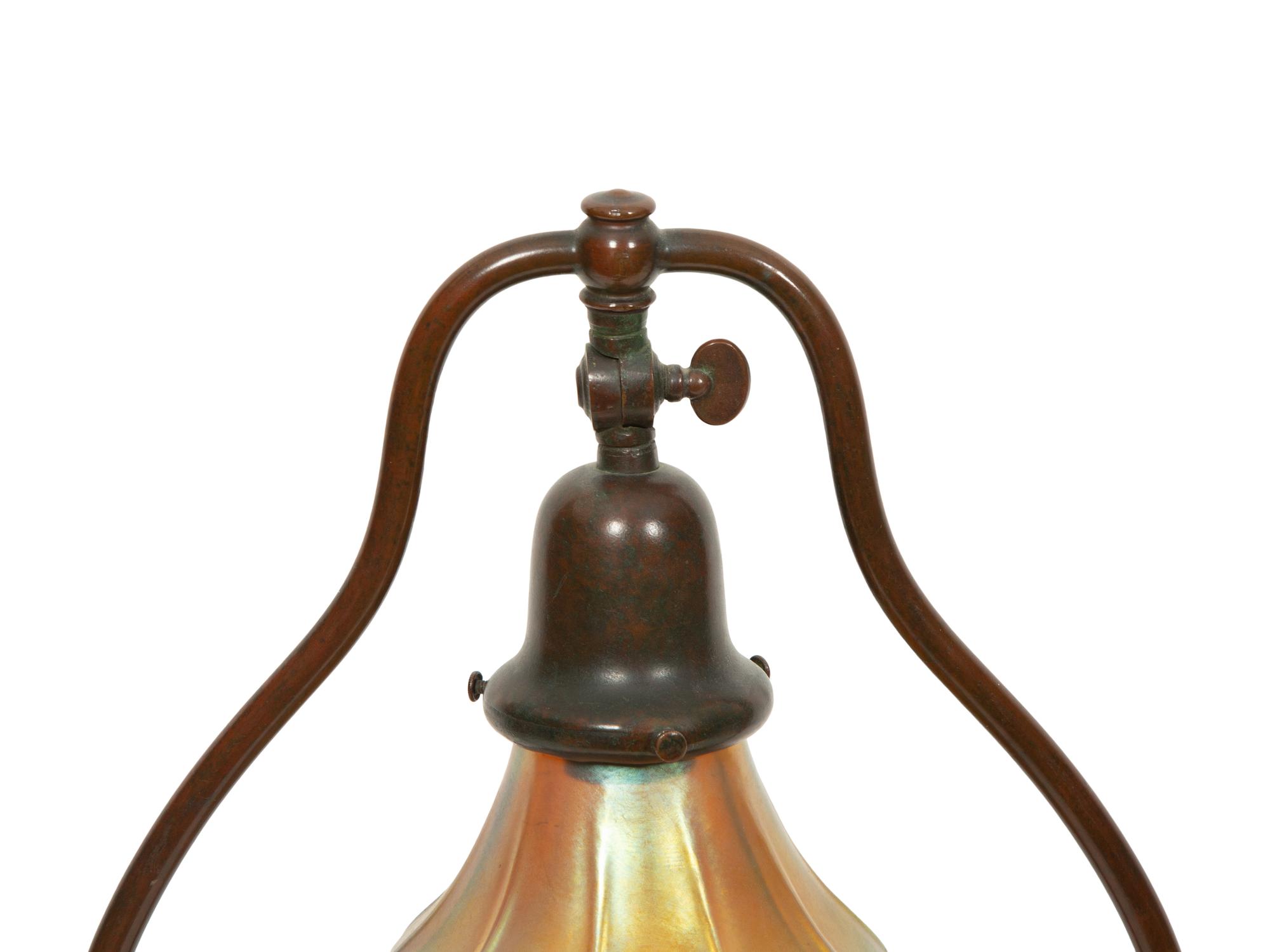 A Handel Bronze Desk Lamp and Two Steuben Aurene Glass Shades