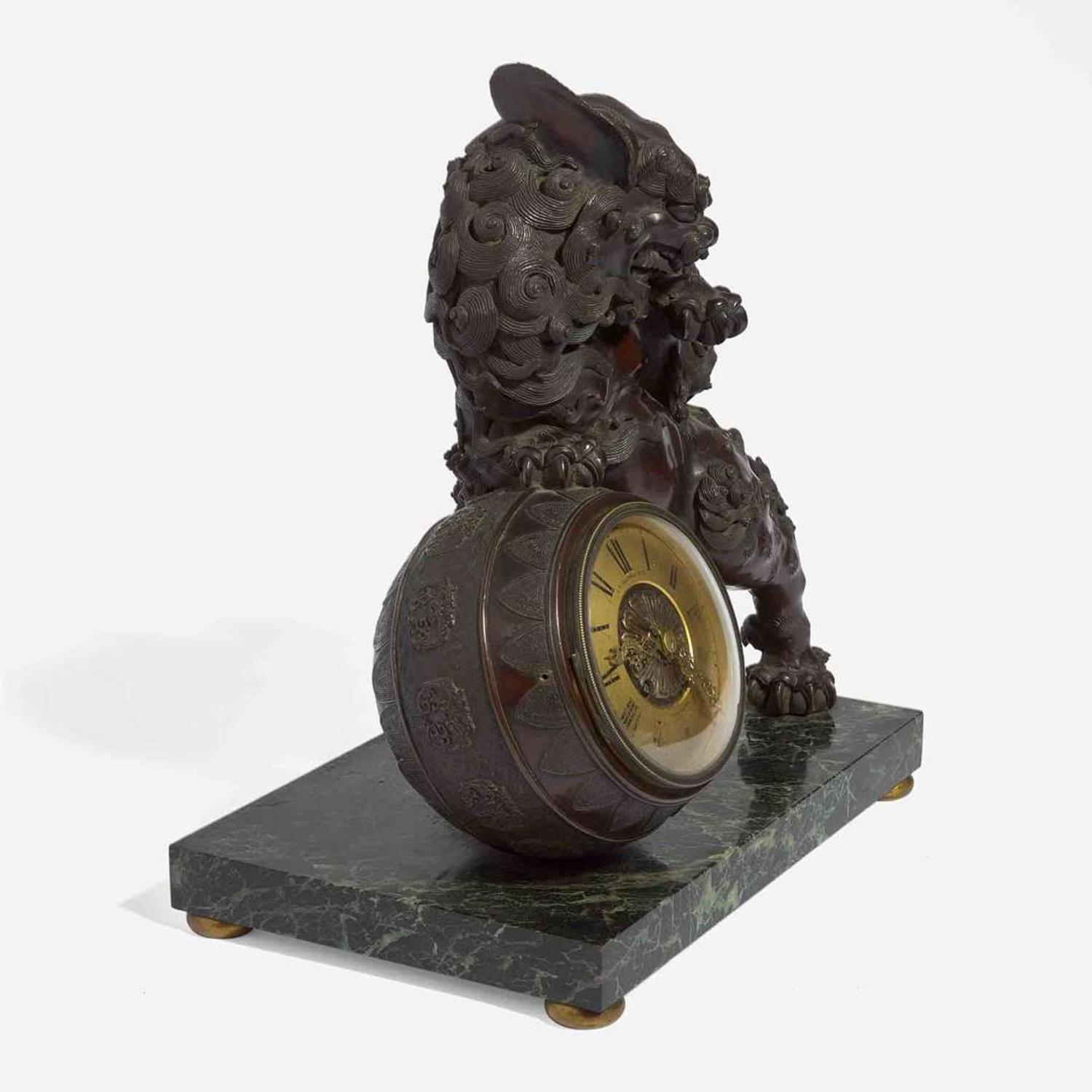 A Japanesque patinated bronze and verde marble mantel clock J.E. Caldwell & Co., Philadelphia, PA, late 19th / early 20th century