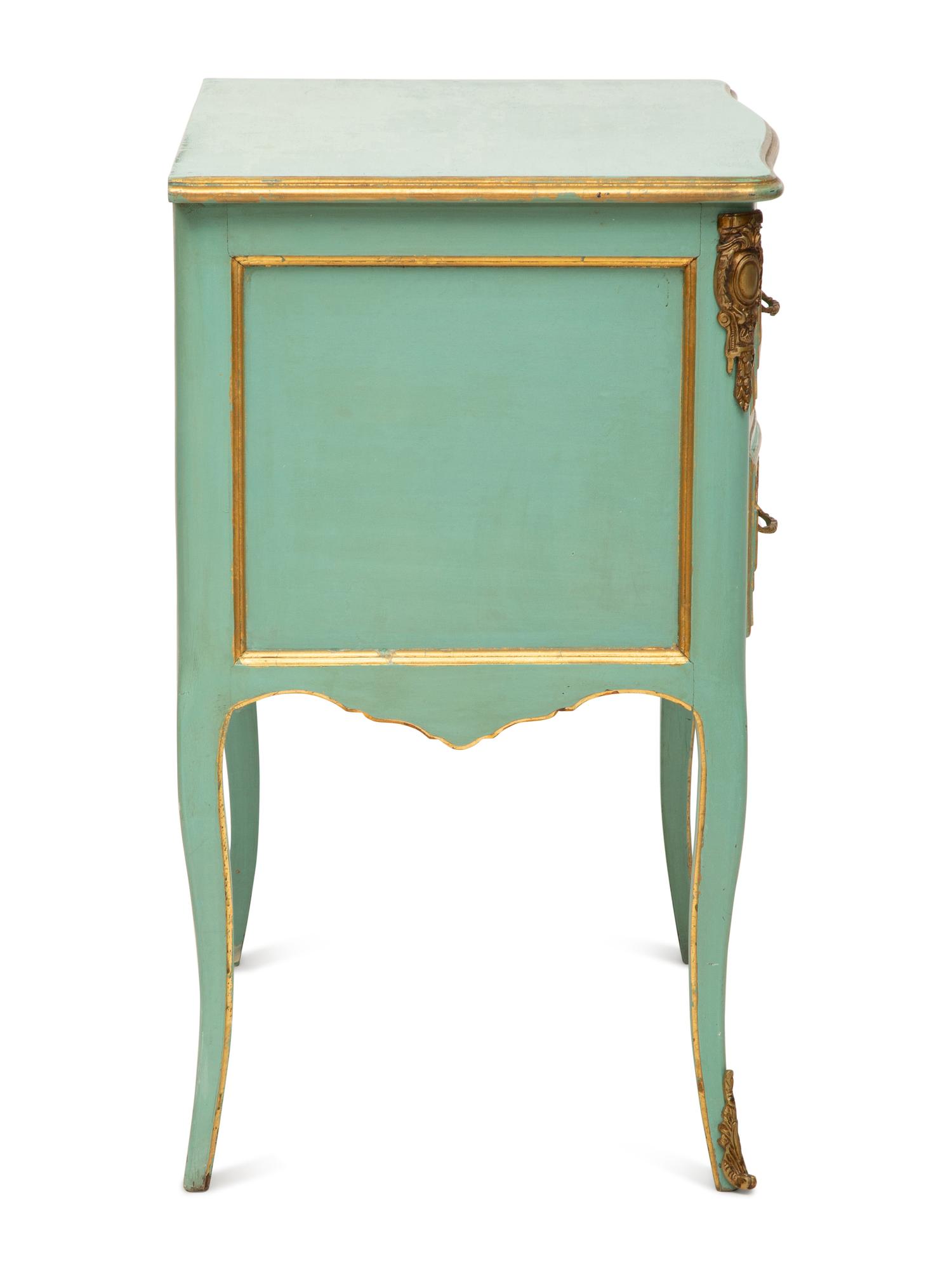 A Louis XV Style Painted and Parcel Gilt Commode