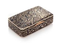 A Russian Niello Silver Snuff Box, Mark of N. Motokhov, Moscow, 1853, the case worked to show floral and foliate scroll decoration.