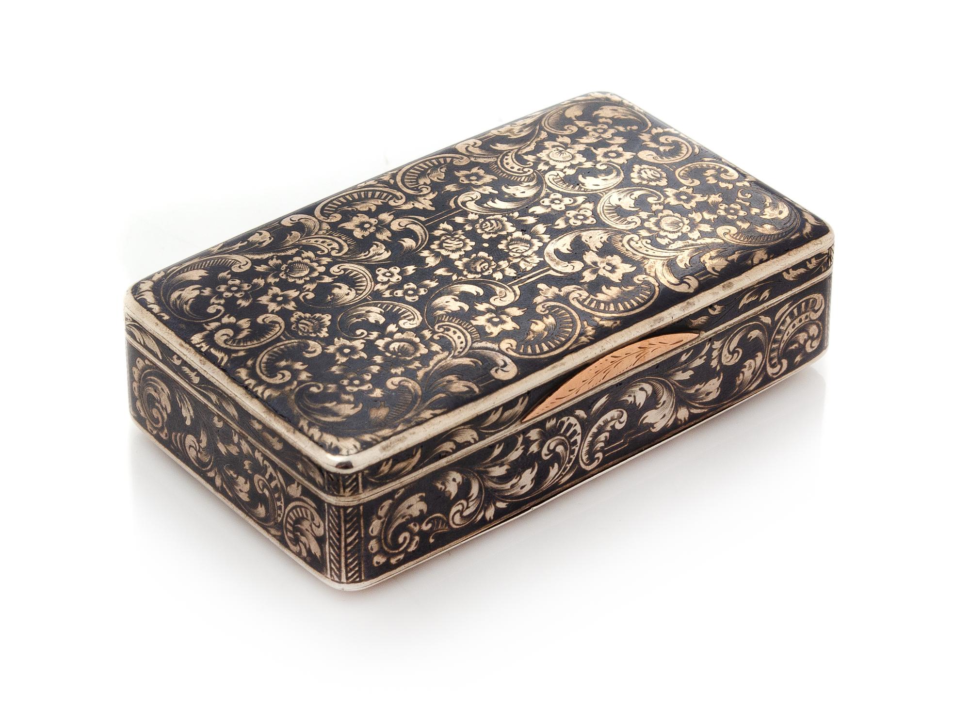 A Russian Niello Silver Snuff Box, Mark of N. Motokhov, Moscow, 1853, the case worked to show floral and foliate scroll decoration.