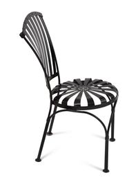 A Spring Steel Garden Table and Eight Chairs by Francois Carre