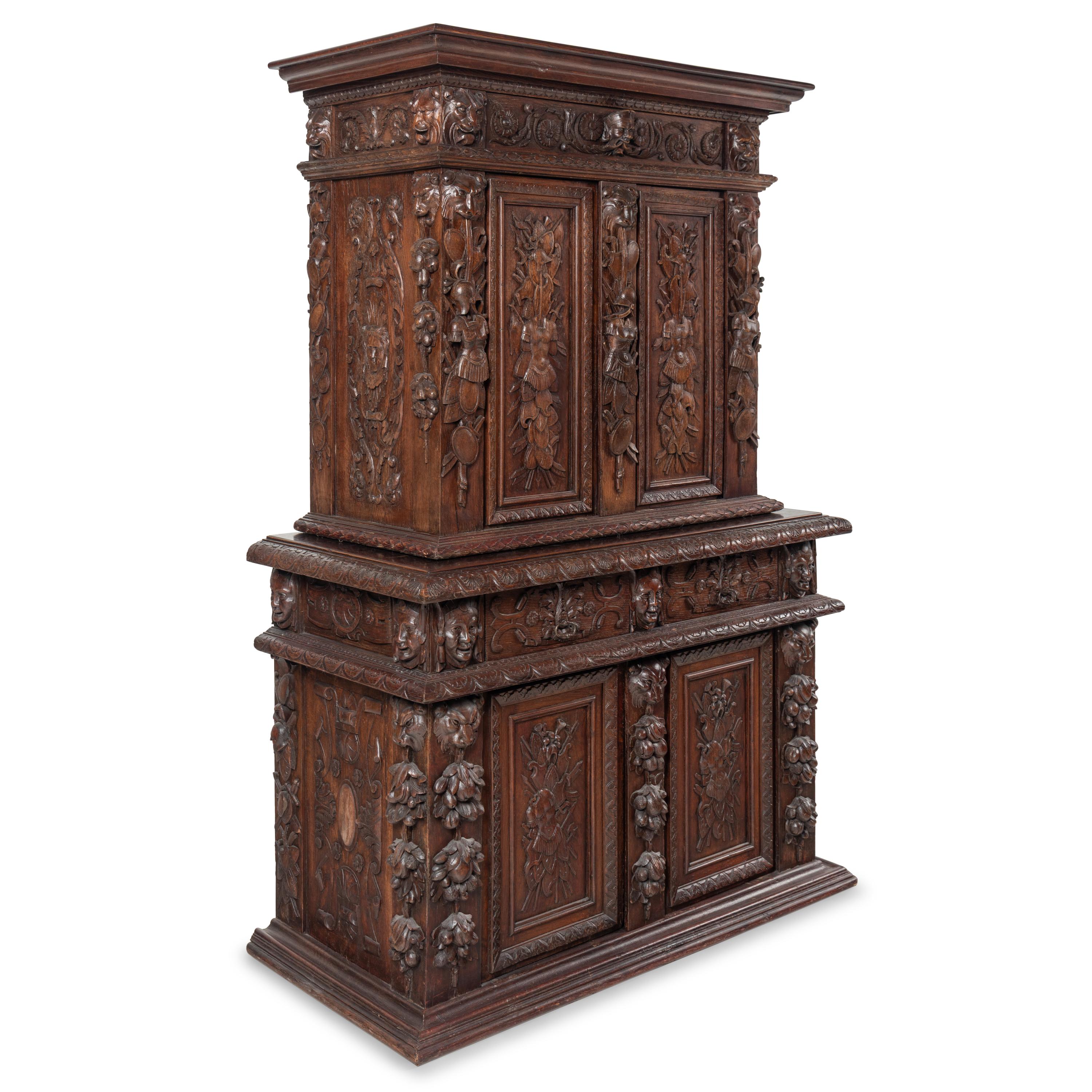 An Italian Renaissance Revival Carved Oak Cabinet
