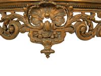 A Louis XV Carved Gilt Wood Serpentine Marble Top Console Table — 18TH/19TH CENTURY