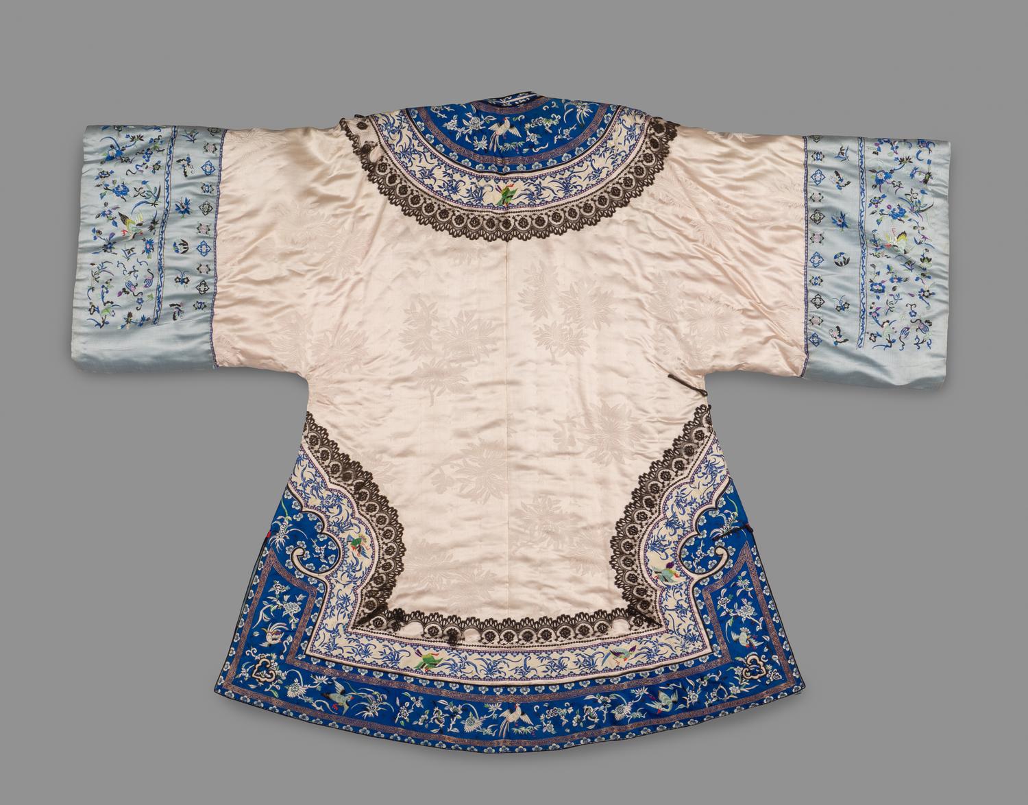 A Chinese Pink Ground Quilted and Embroidered Silk Lady's Coat