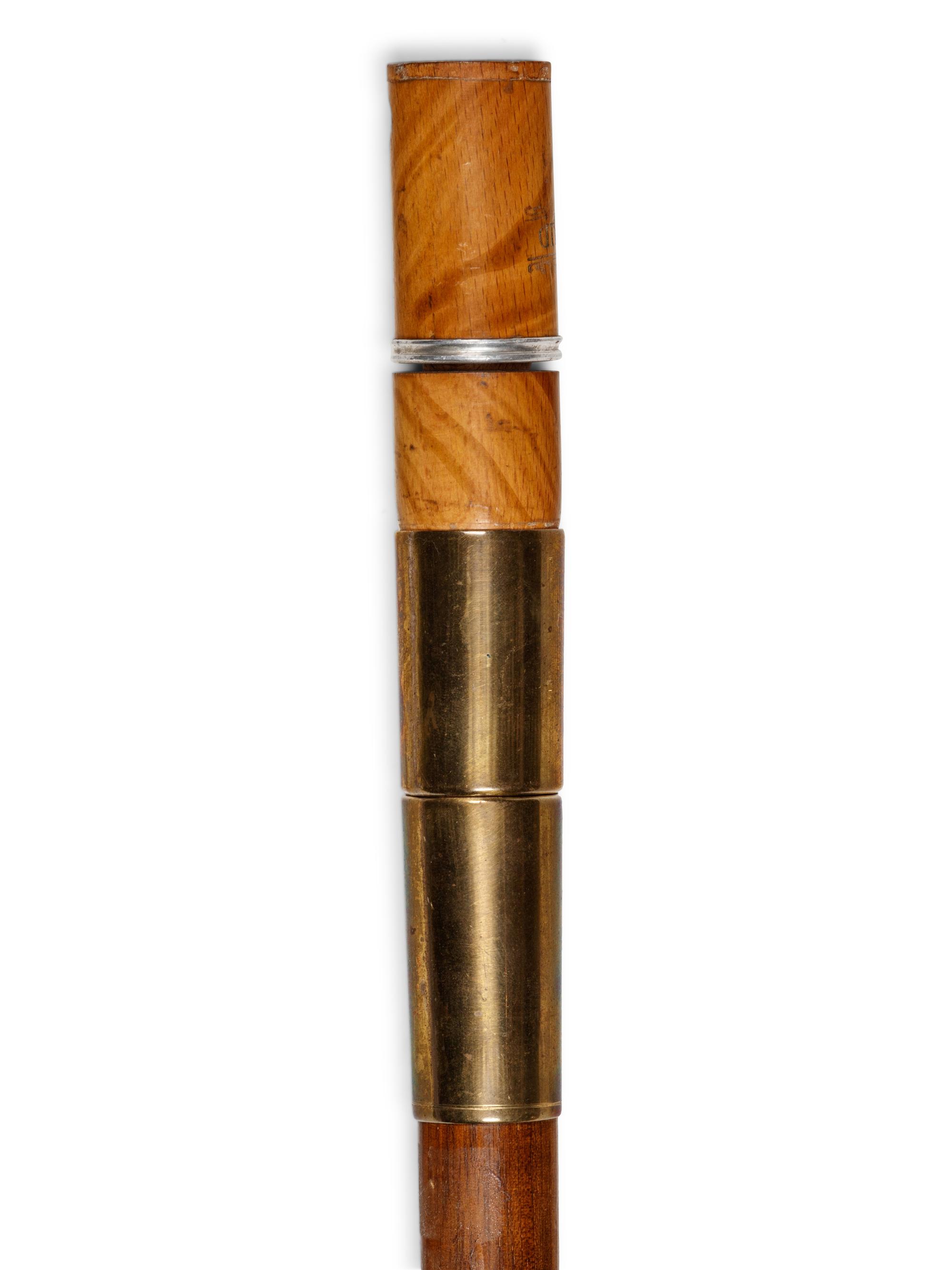 A Brass Mounted Walnut Souvenir Smoker's 'System' Walking Stick