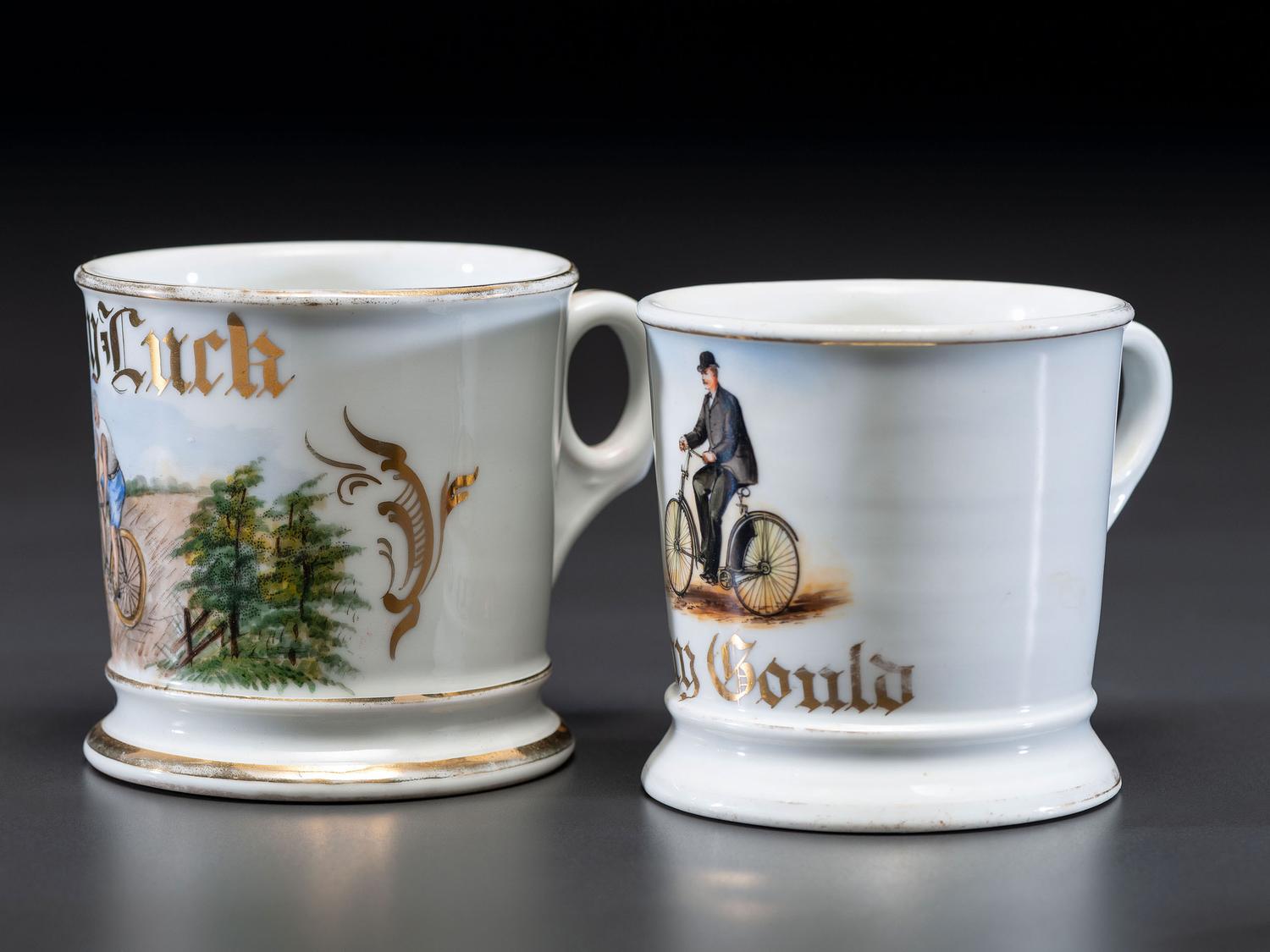 Two Cyclist's Porcelain Shaving Mugs