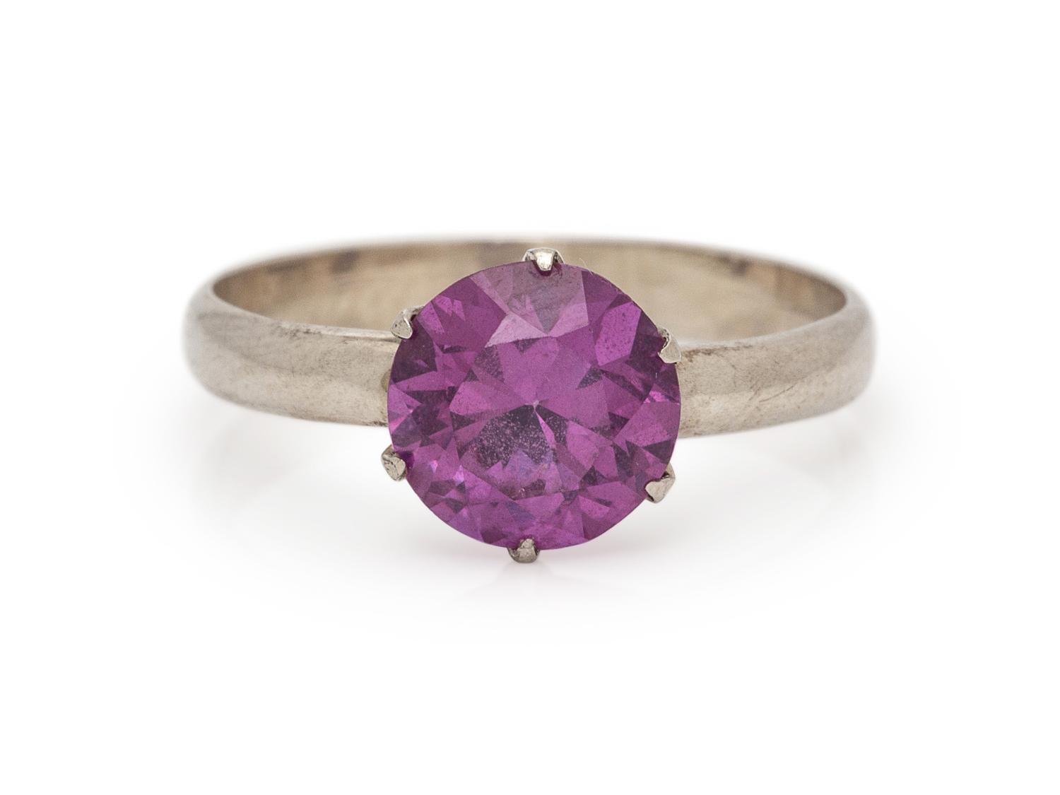 A 14 Karat White Gold and Synthetic Color Change Sapphire Ring,