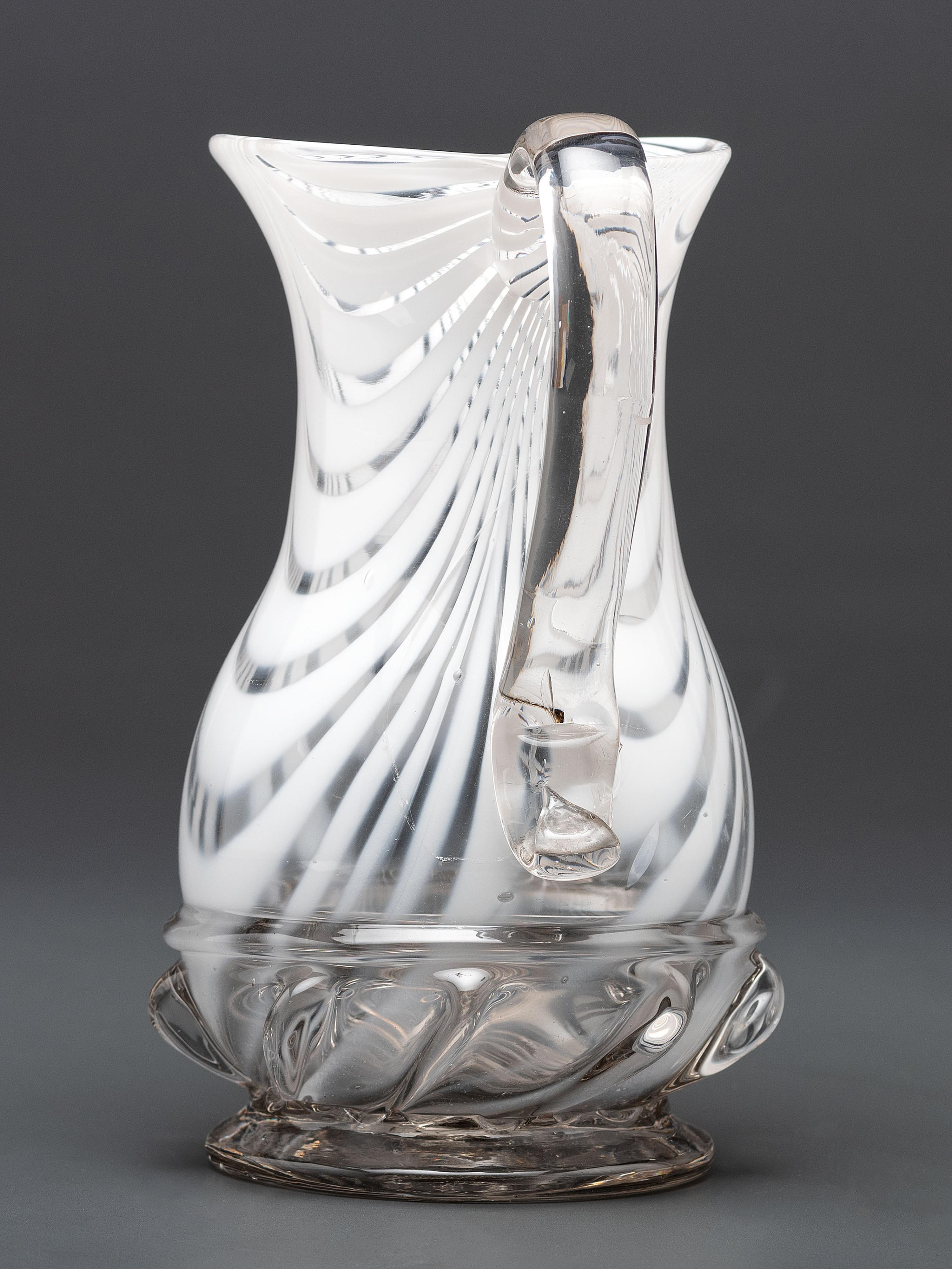 A New Jersey Blown-Glass Pitcher in Clear with White Swirls