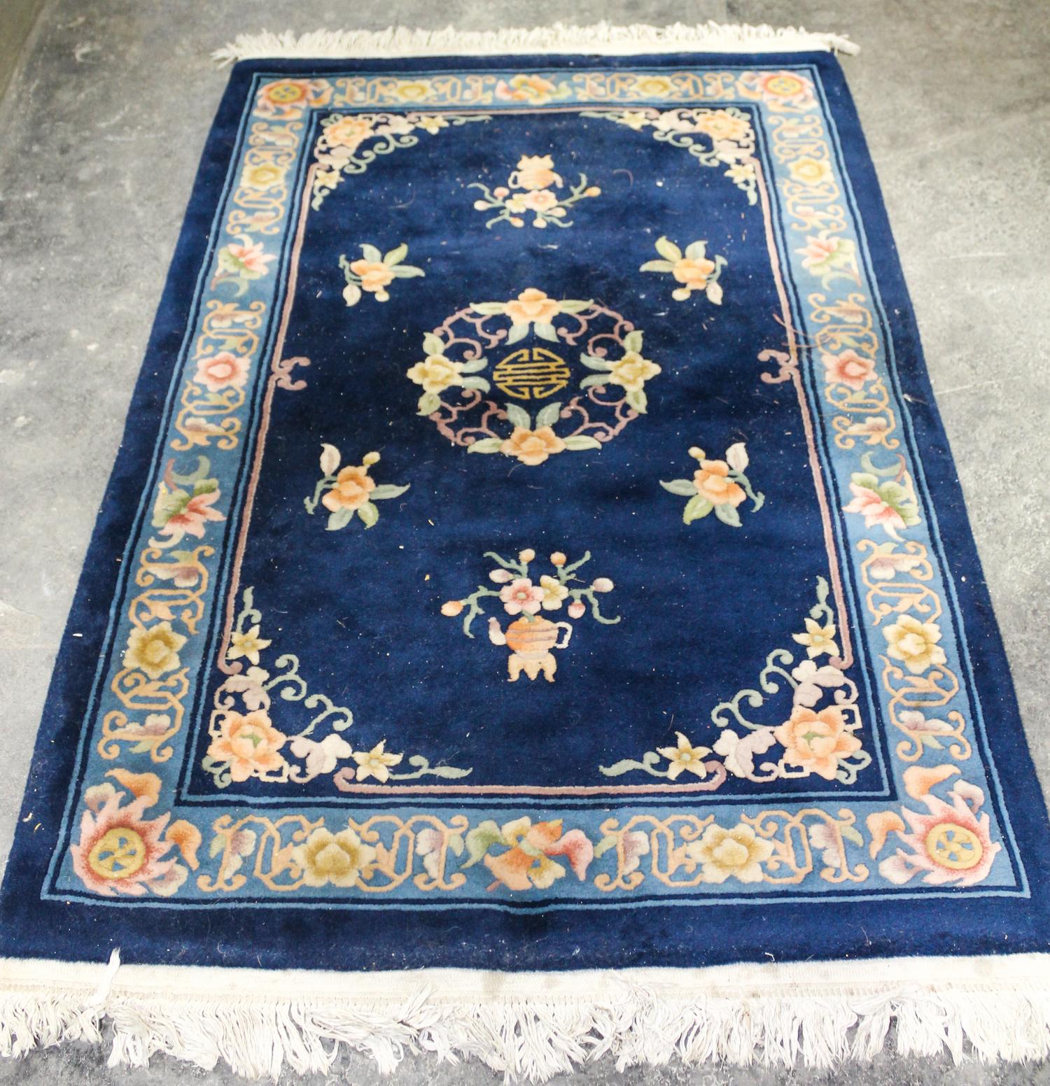 A Chinese Wool Rug 6 feet x 4 feet.
