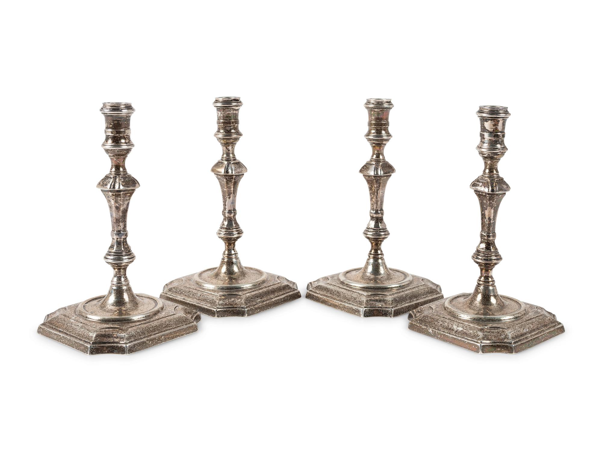 A Set of Four Currier & Roby Silver Taper Sticks