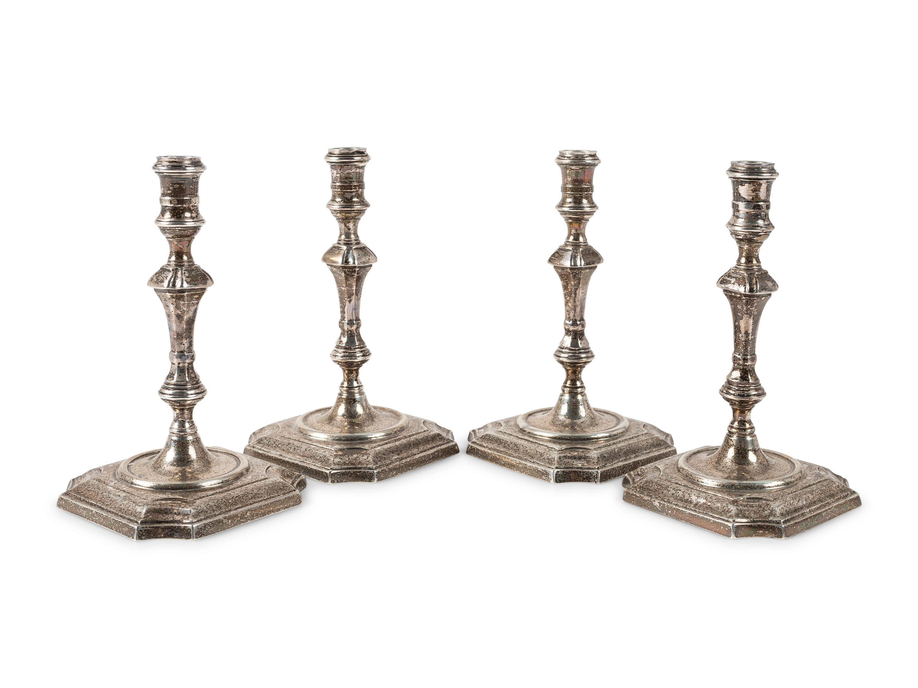A Set of Four Currier & Roby Silver Taper Sticks