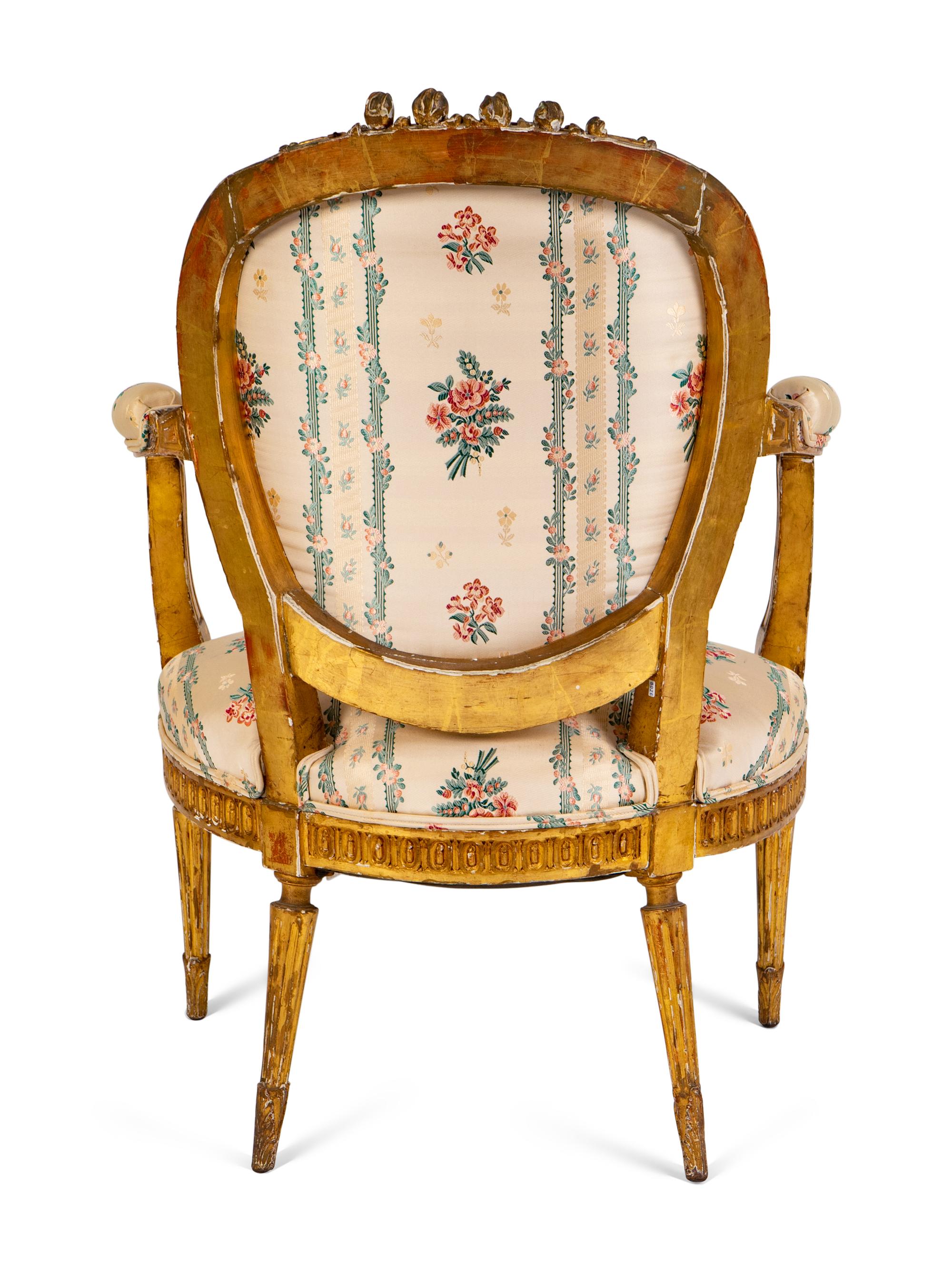 A Louis XVI Carved Giltwood Fauteuil — LATE 18TH/EARLY 19TH CENTURY