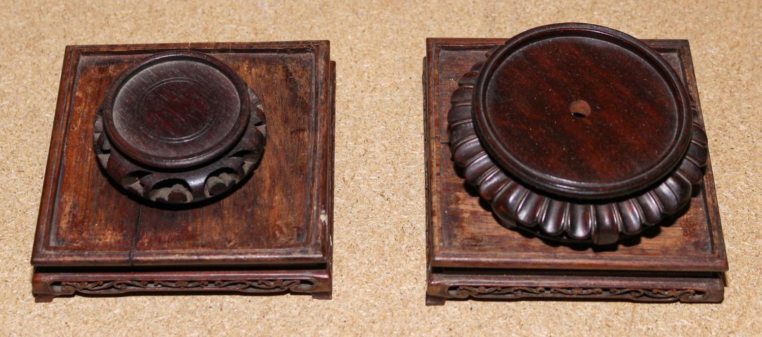 A Collection of Four Hardwood Carved Stands Height of largest 1 1/4 x 4 1/2 inches.