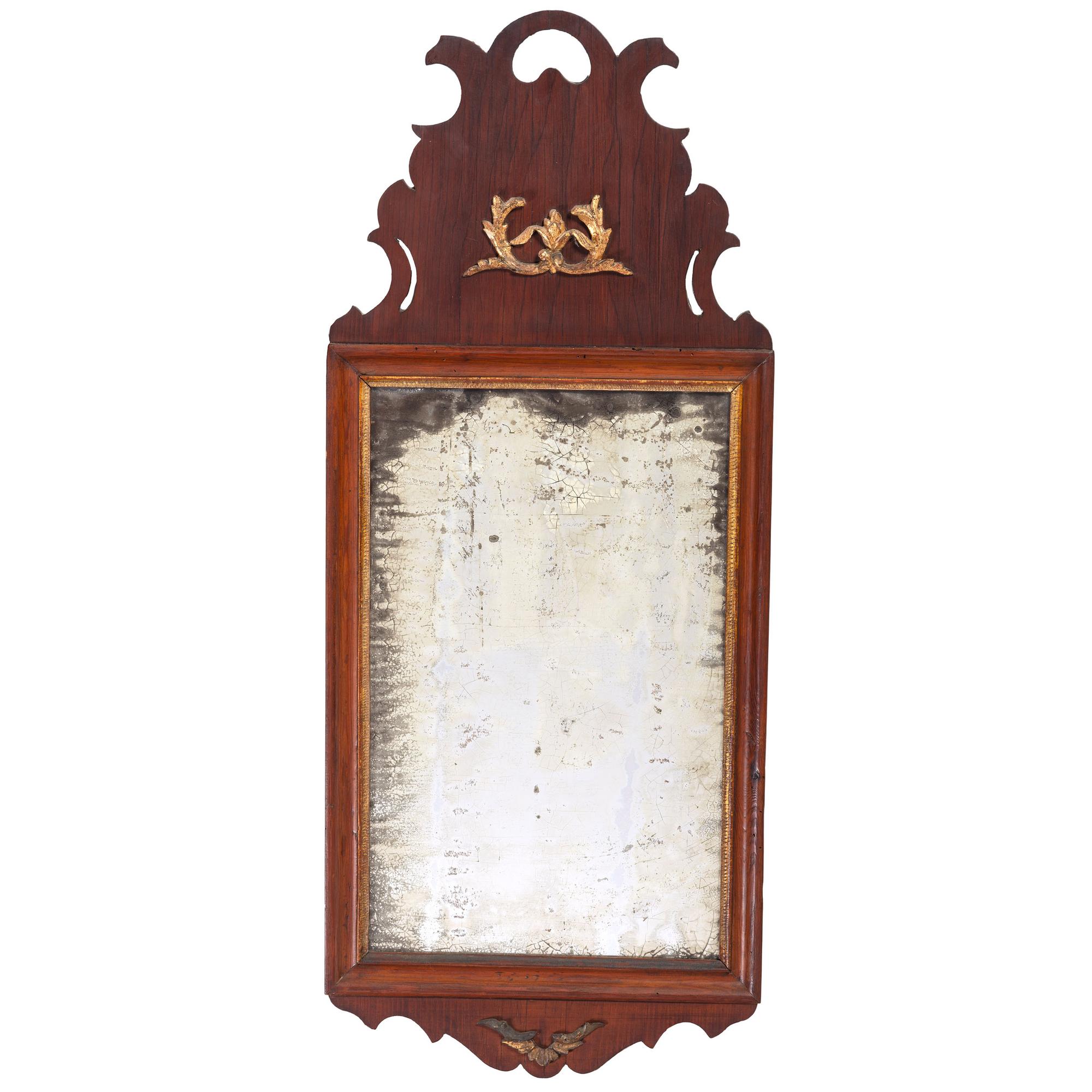 A Queen Anne Parcel Gilt and Carved Walnut Looking Glass