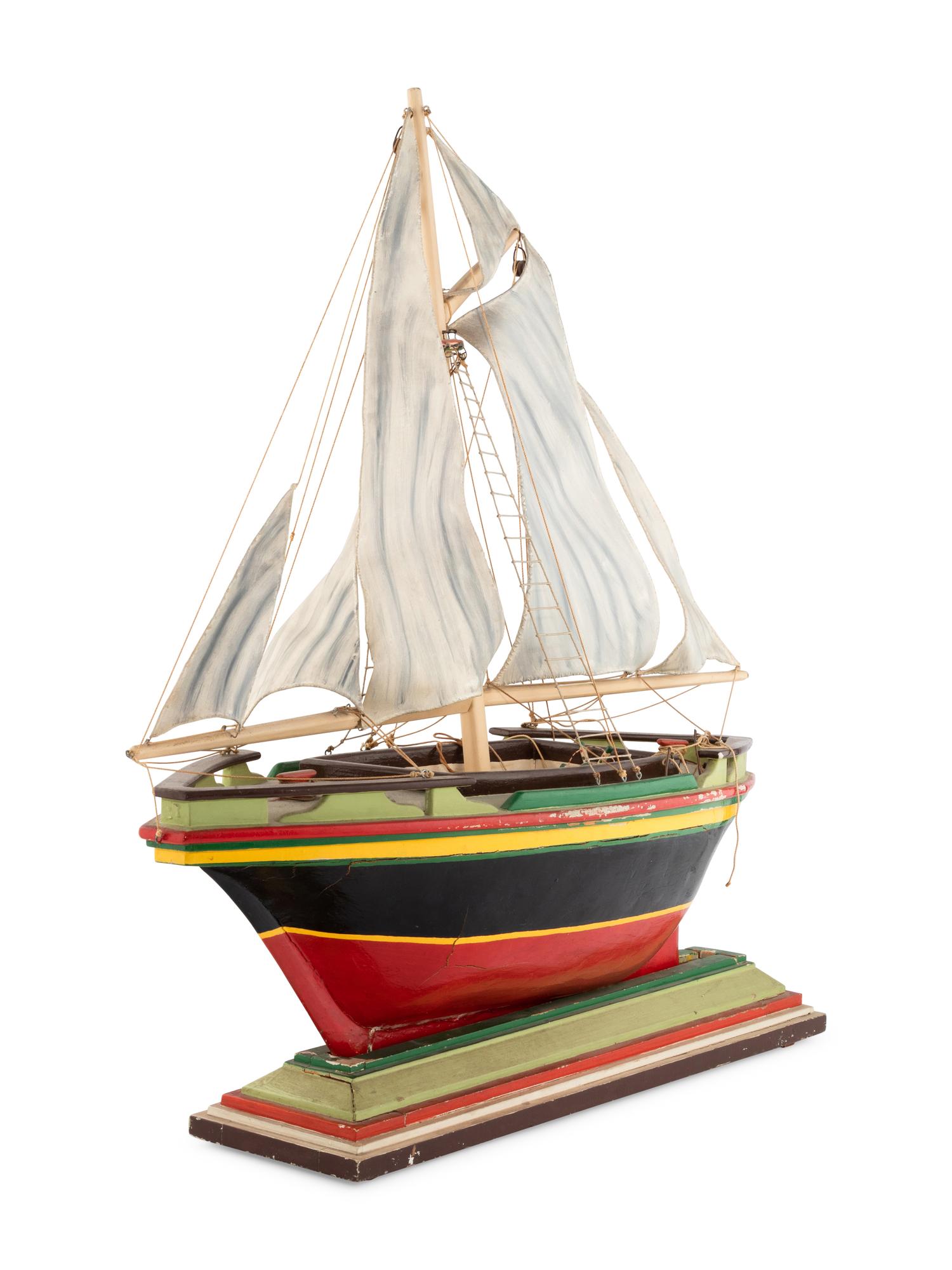 A Carved and Polychrome Painted Wooden Ship Model