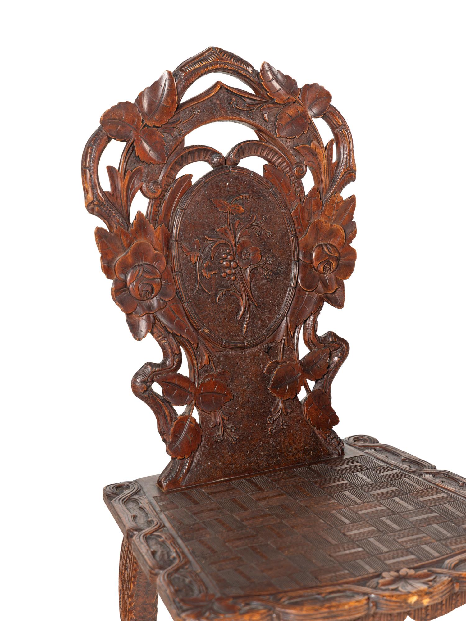 Three Black Forest Carved Side Chairs