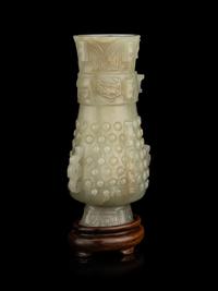 A Carved Pale Celadon Jade Hu Vase