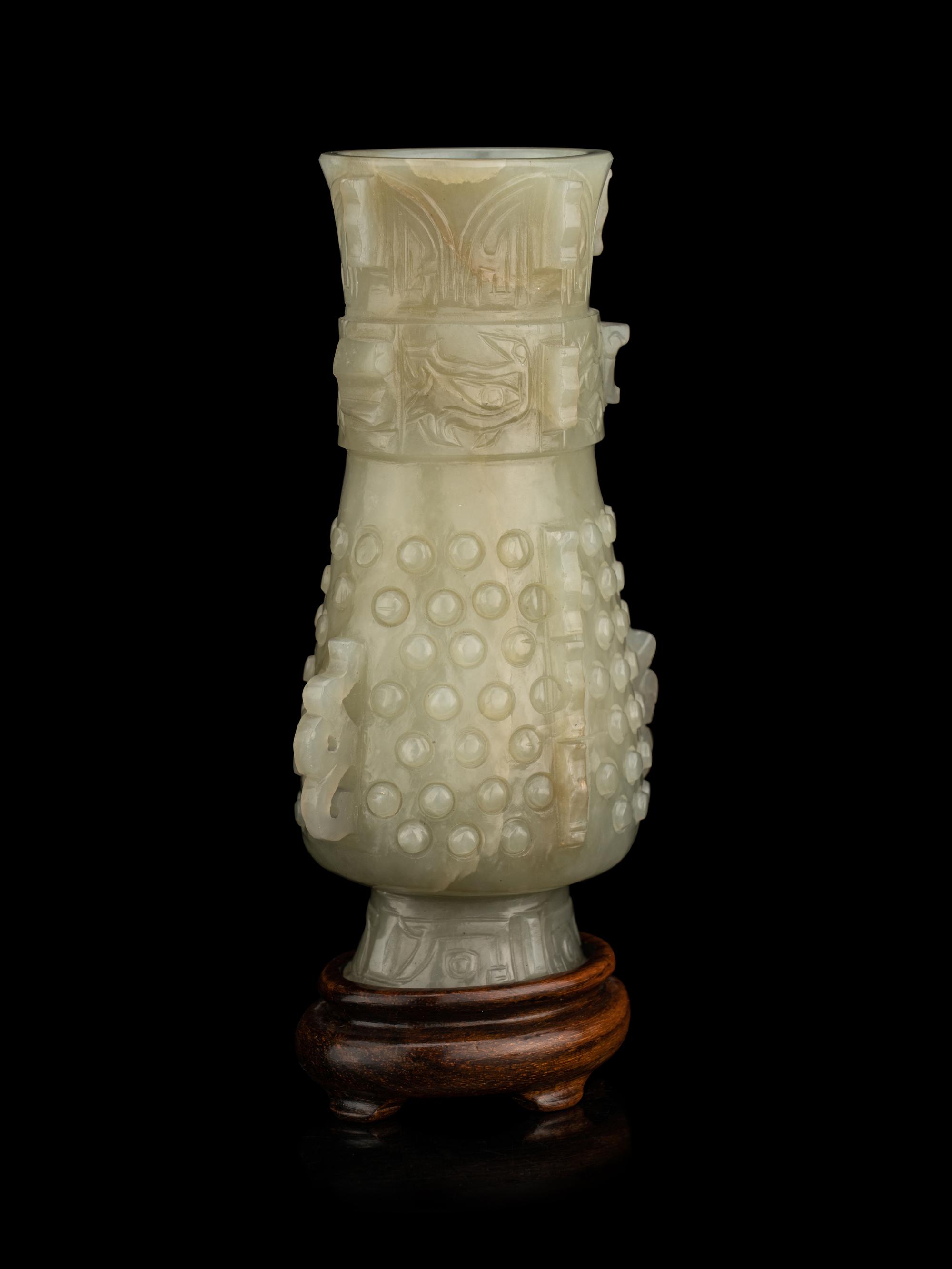 A Carved Pale Celadon Jade Hu Vase