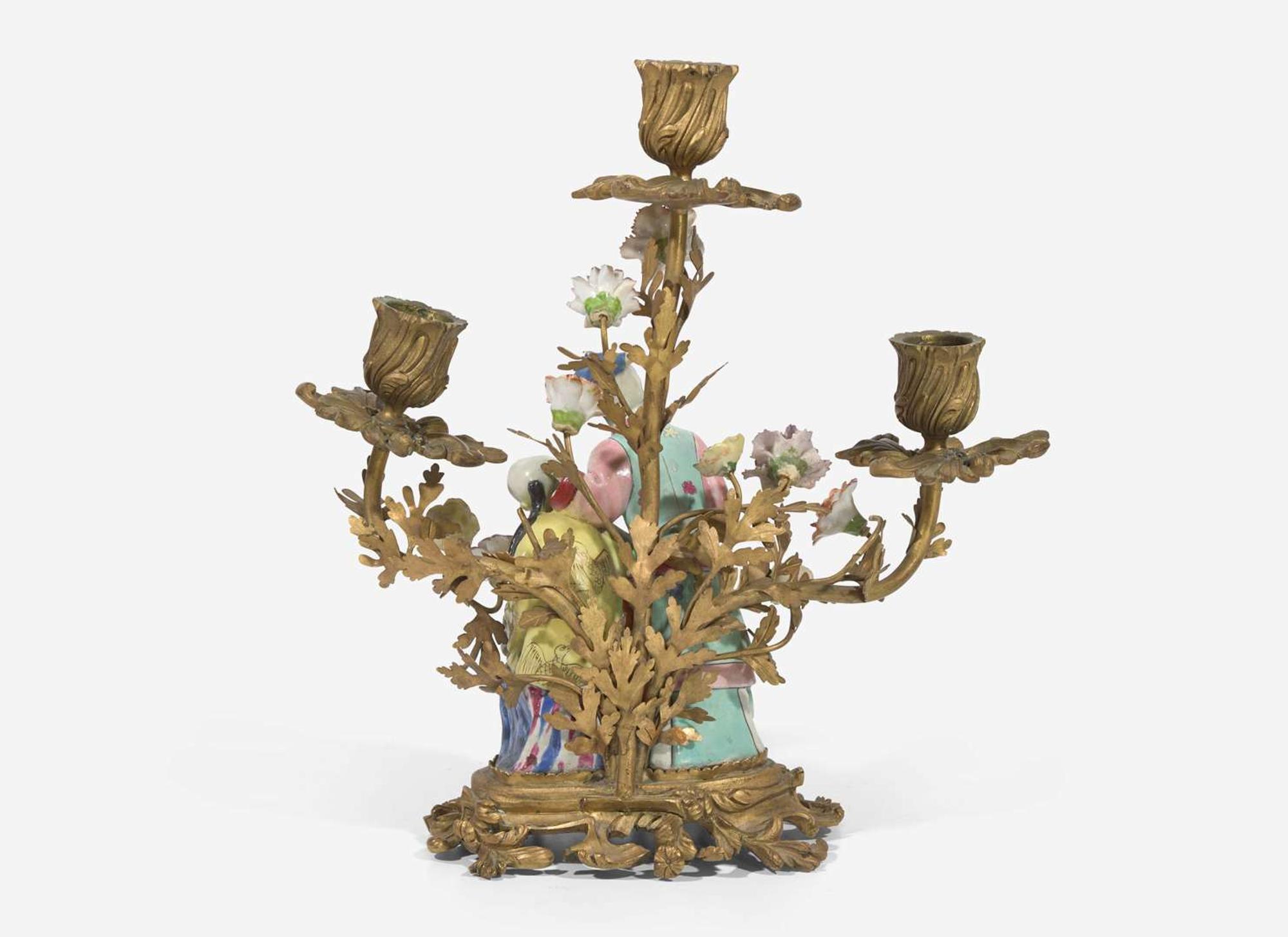 A gilt-bronze mounted Chinese figural porcelain three-light candelabra, the figure 18th century, the gilt bronze 19th century