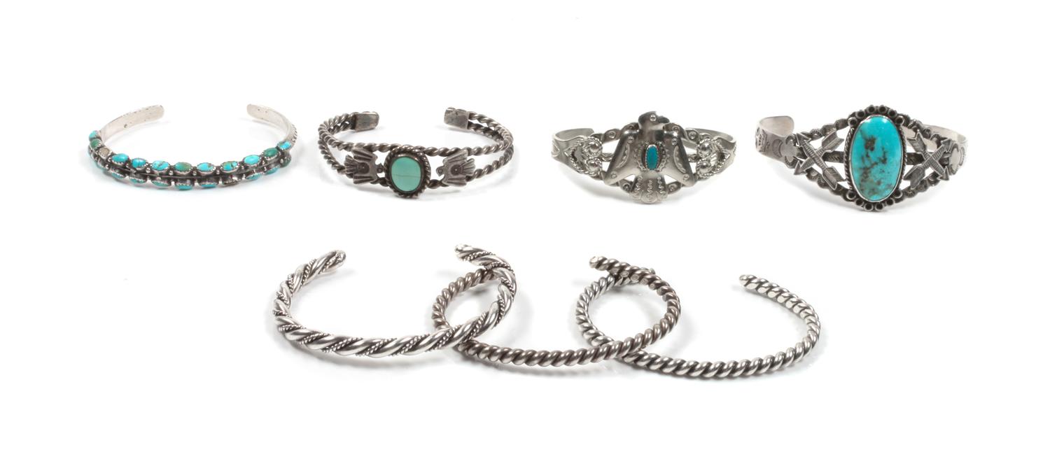 Seven Southwestern Silver Bracelets Length of largest 5 3/4 x opening 2 1/2 x width 1 1/4 inches