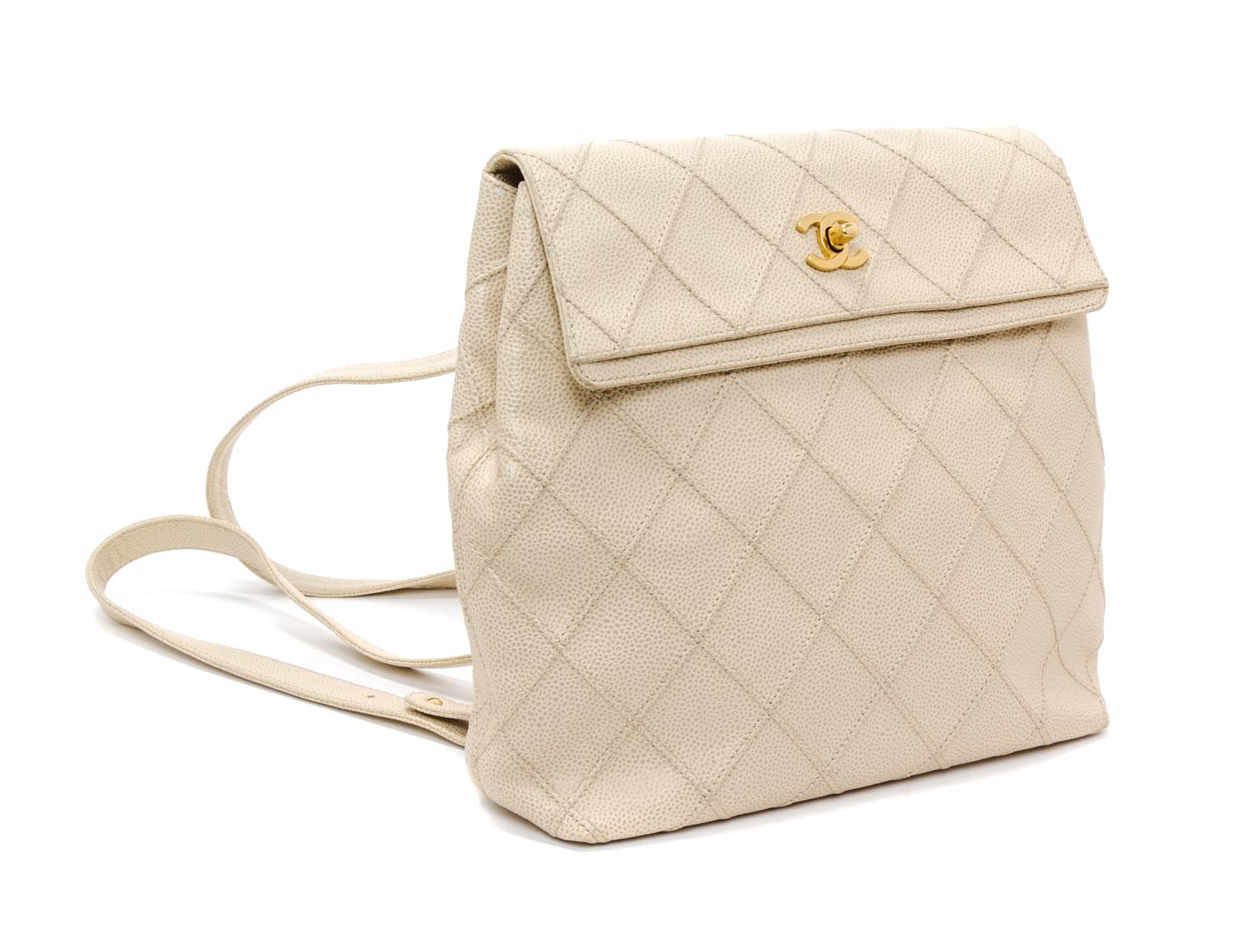 A Chanel Cream Caviar Leather Quilted Backpack, 12"x 10" x 3".