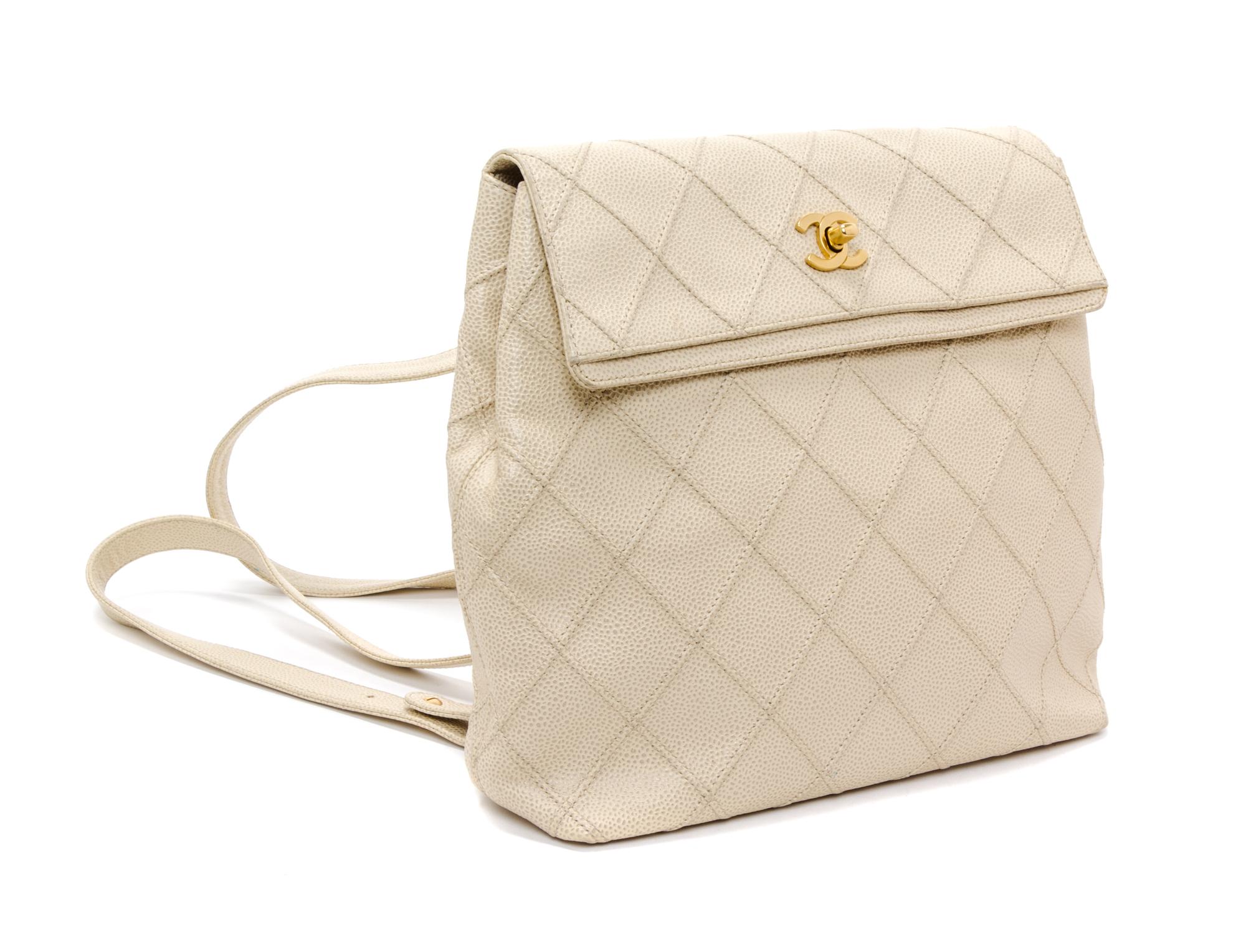 A Chanel Cream Caviar Leather Quilted Backpack, 12"x 10" x 3".