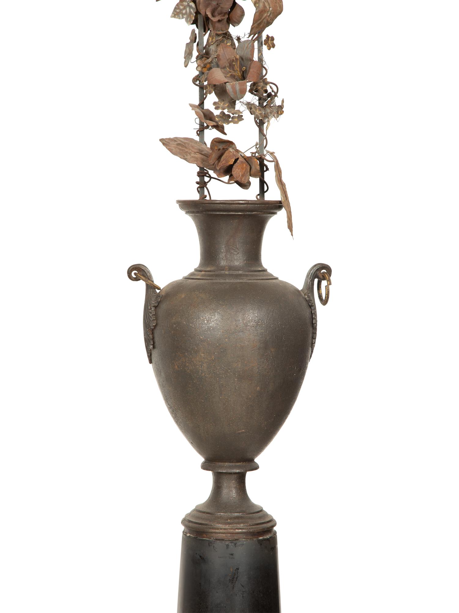 A Pair of French Bronze Urns with Tole Trellises of Floral Vines on Marble Pedestals