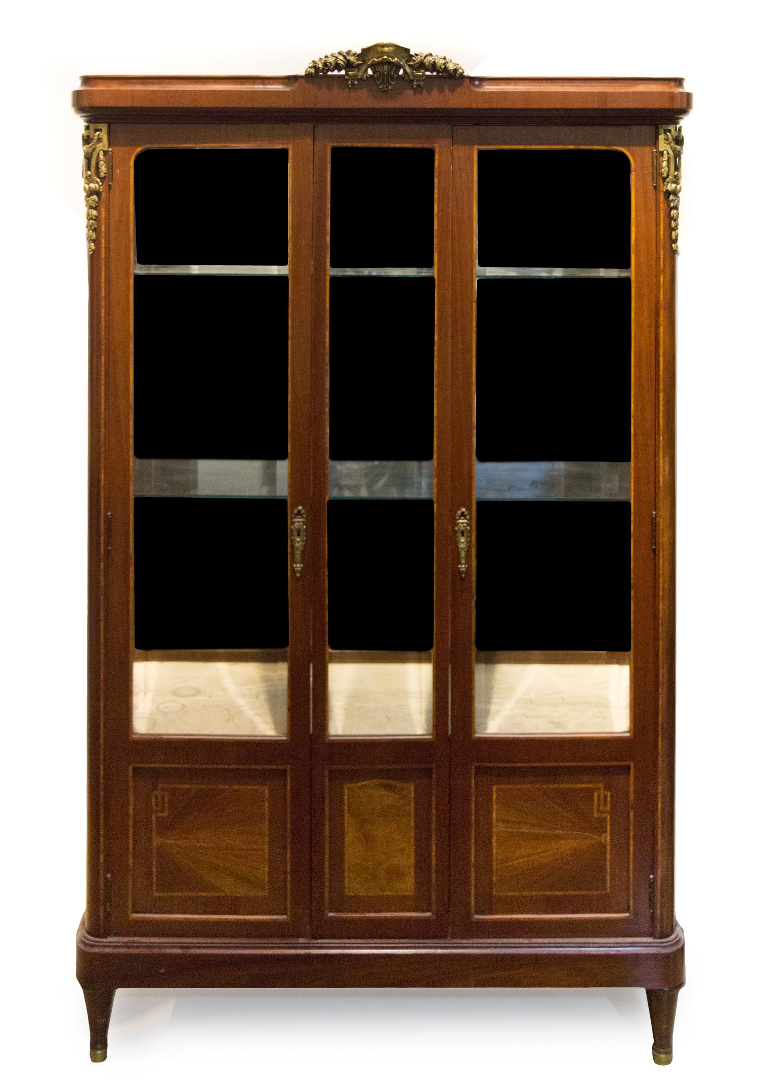 A Louis XVI Style Gilt Bronze Mounted Mahogany Vitrine Height 72 x width 43 1/2 x depth 17 inches. — EARLY 20TH CENTURY