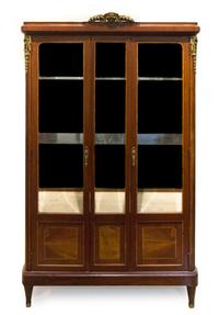 A Louis XVI Style Gilt Bronze Mounted Mahogany Vitrine Height 72 x width 43 1/2 x depth 17 inches. — EARLY 20TH CENTURY