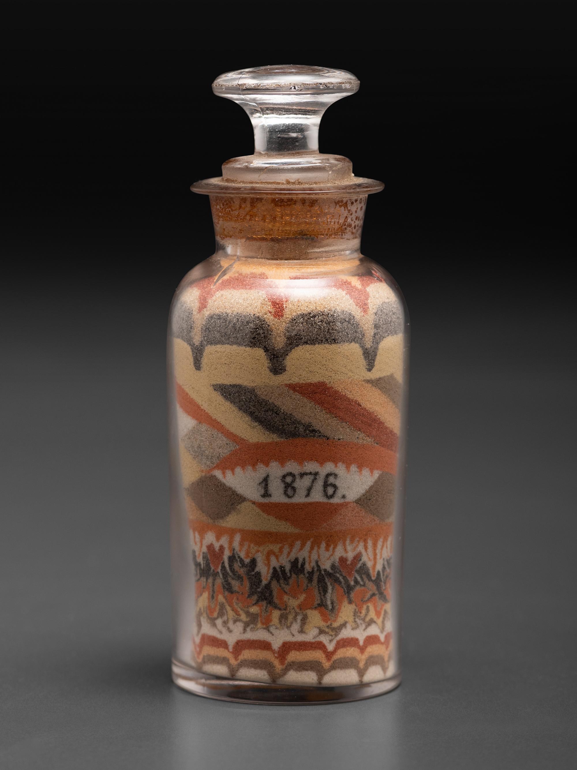 An Early Andrew Clemens (American, 1857-1894) Eagle Sand Bottle