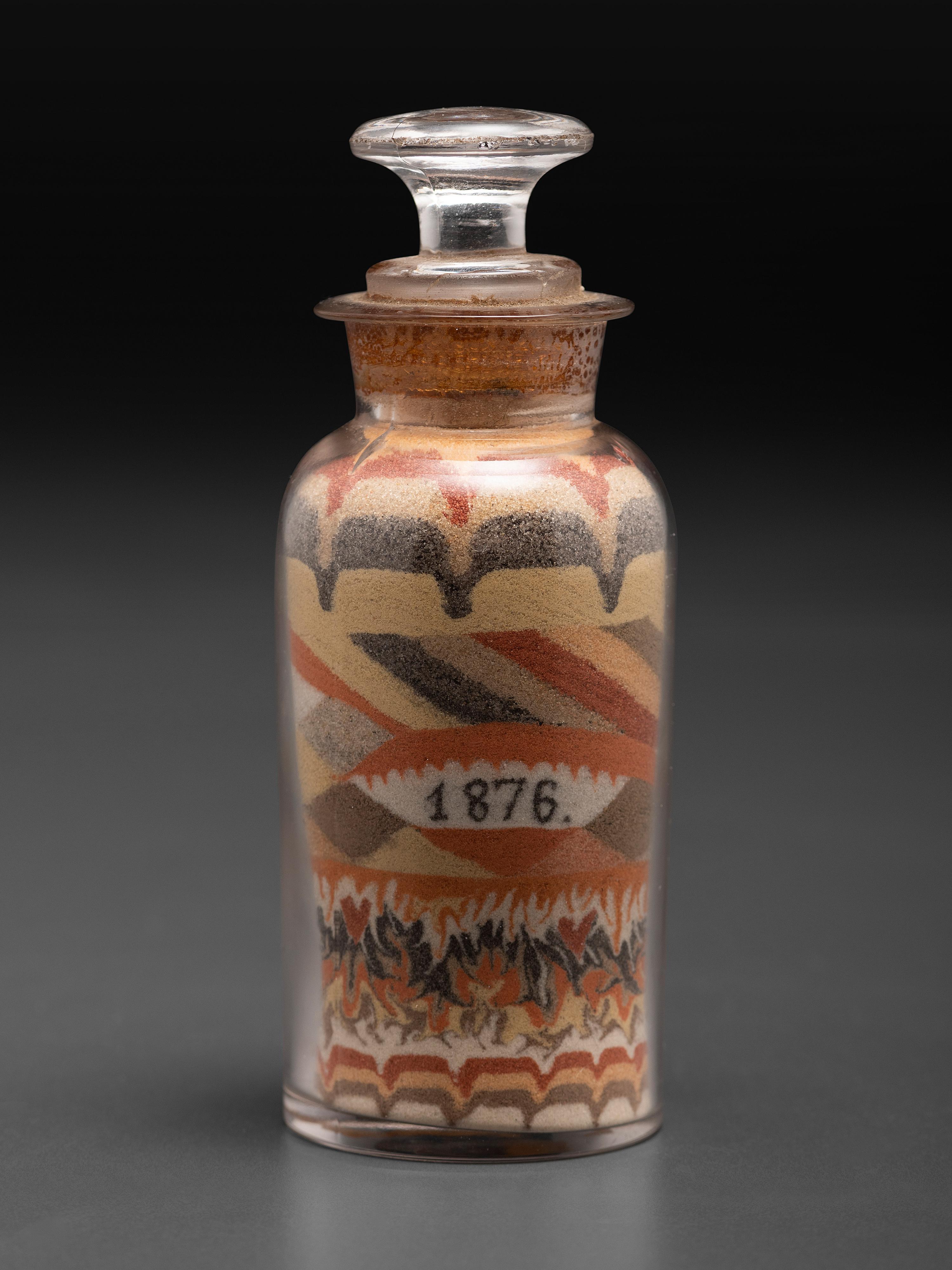 An Early Andrew Clemens (American, 1857-1894) Eagle Sand Bottle