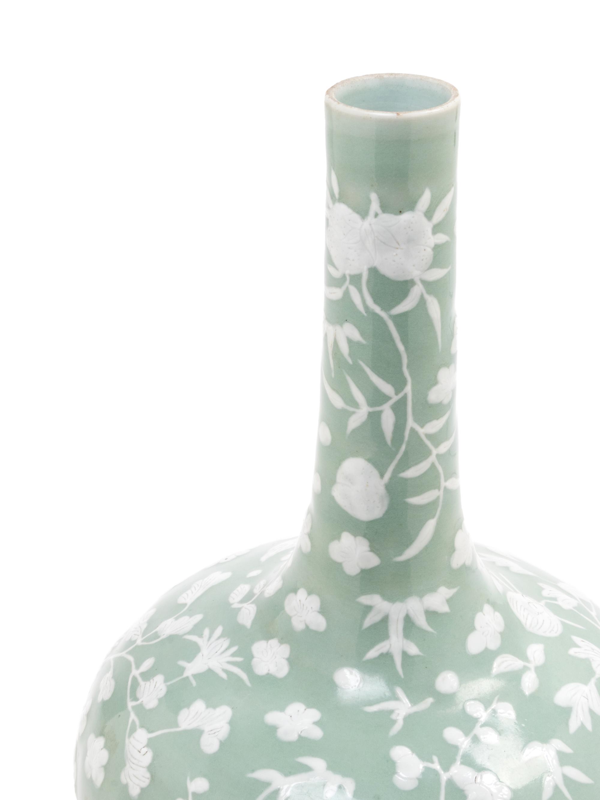 A Celadon Ground White Slip-Decorated Porcelain Bottle Vase