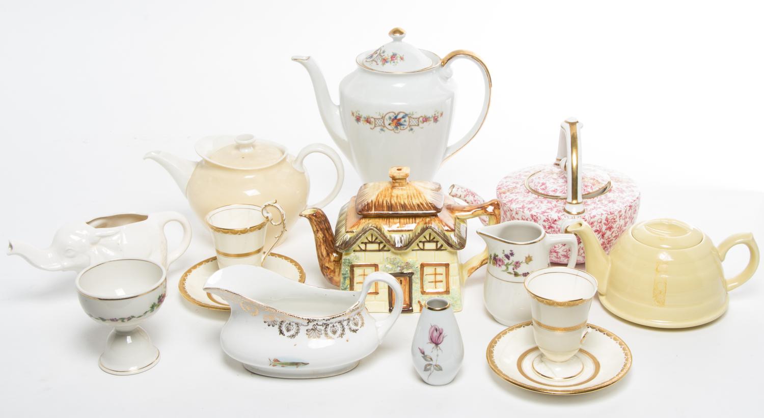 A Group of Teapots Height of tallest 10 inches.