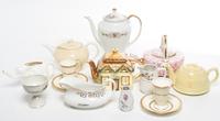 A Group of Teapots Height of tallest 10 inches.