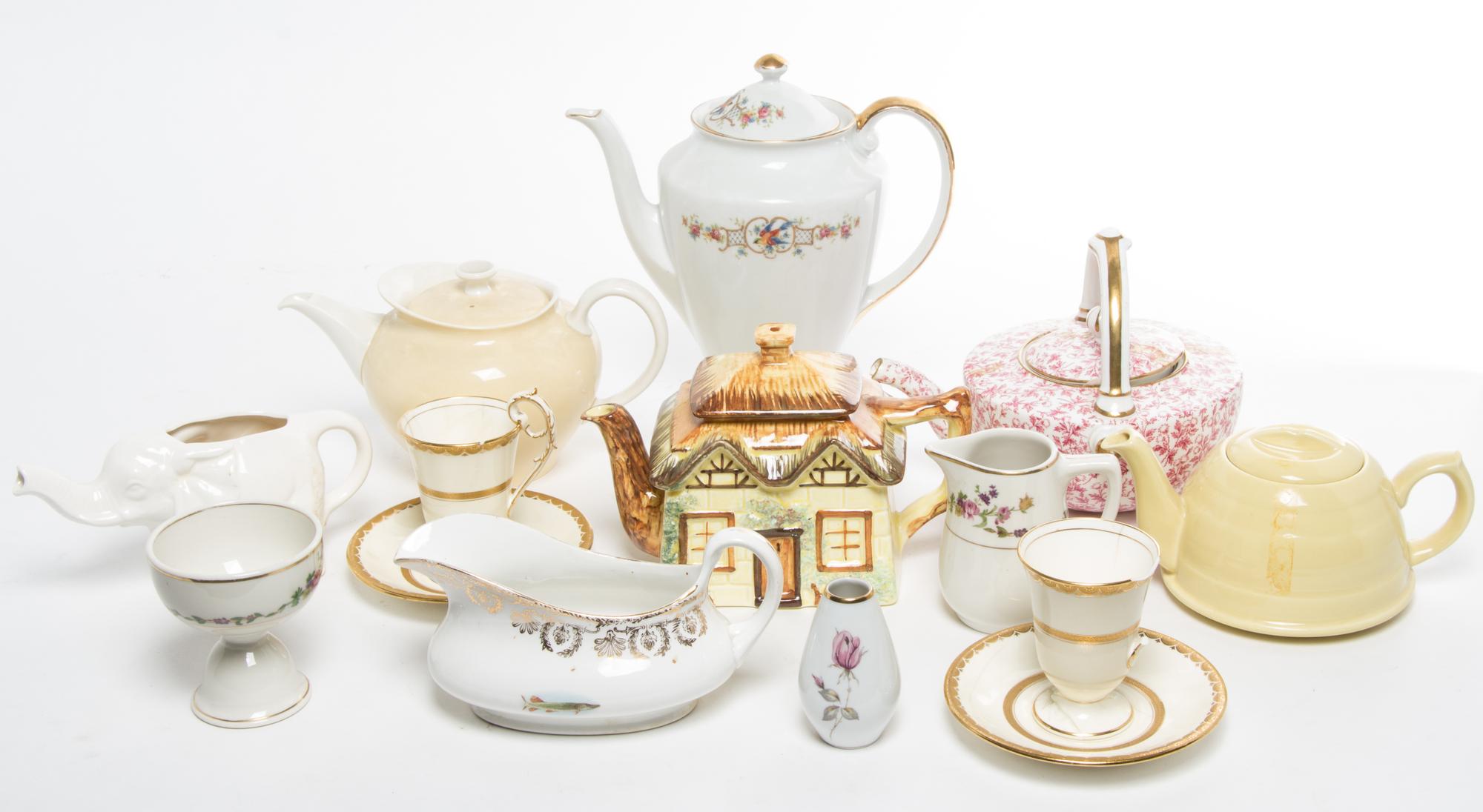 A Group of Teapots Height of tallest 10 inches.