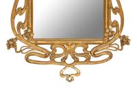 A Continental Art Nouveau Giltwood Mirror