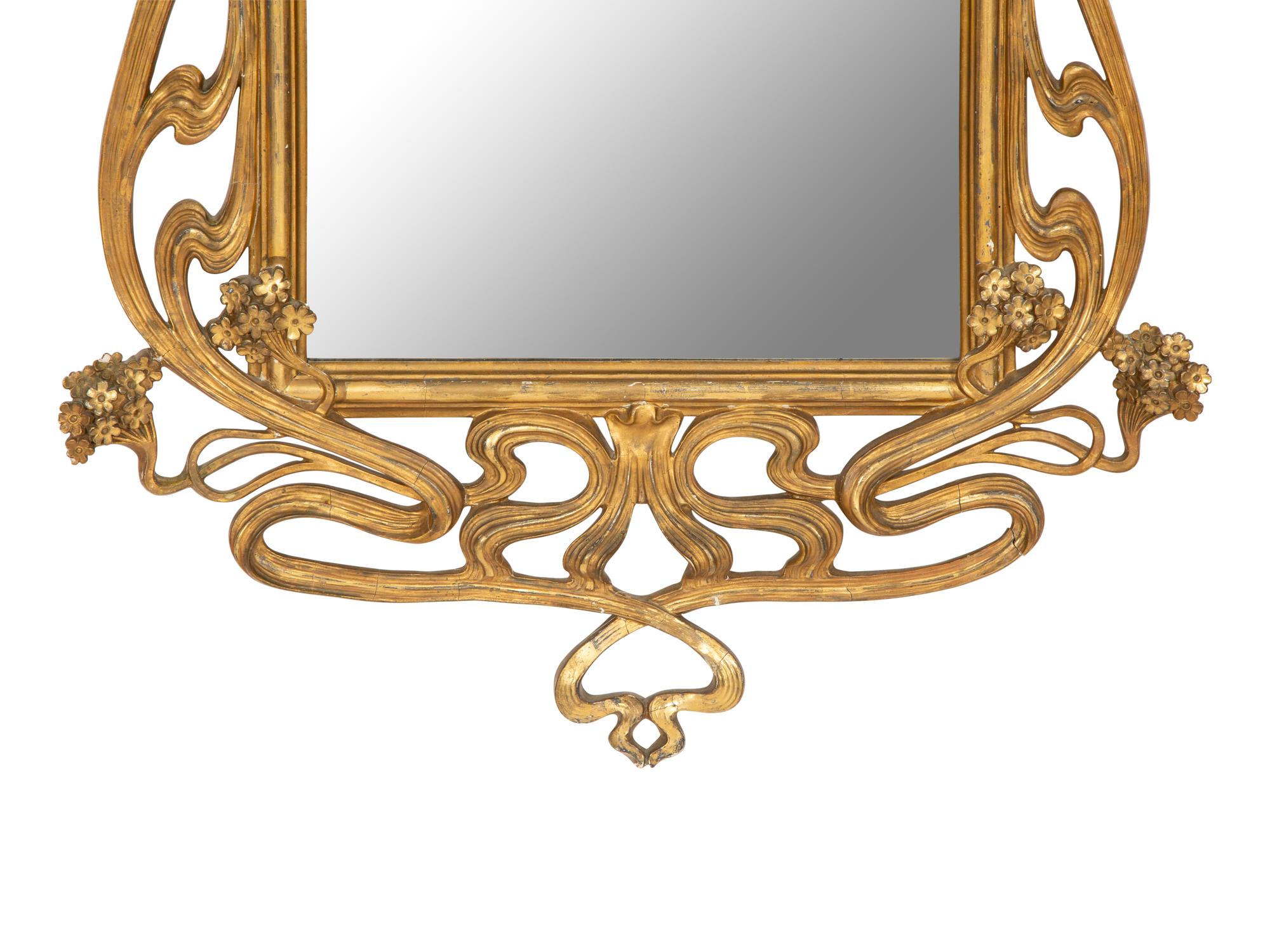 A Continental Art Nouveau Giltwood Mirror