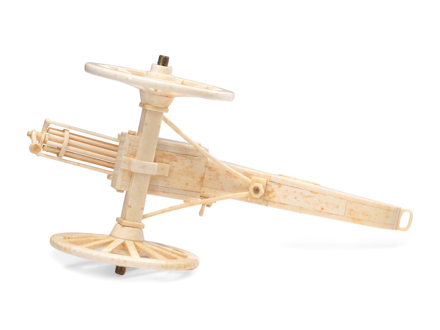 A Carved Walrus Ivory and Bone Gatling Gun Model